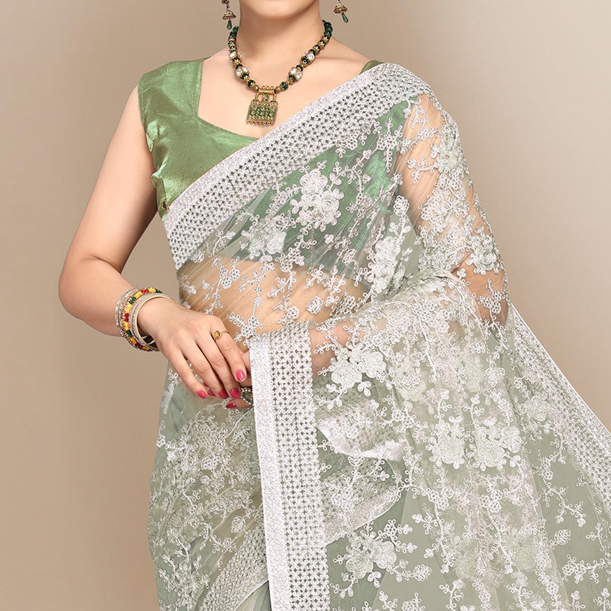Green Partywear Floral Embroidered Soft Net Saree - Peachmode