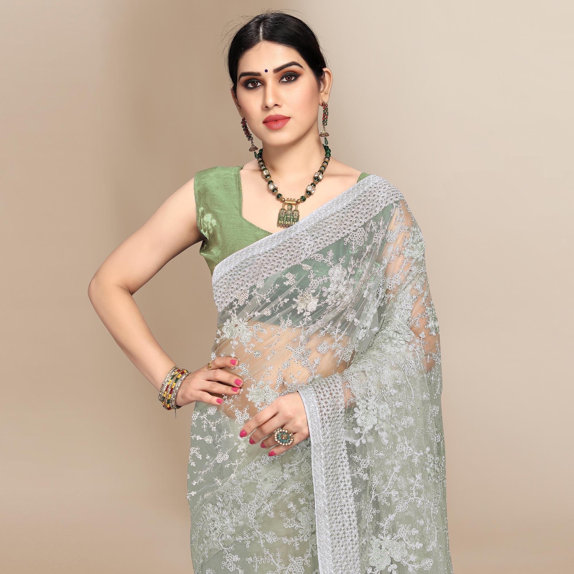 Green Partywear Floral Embroidered Soft Net Saree - Peachmode