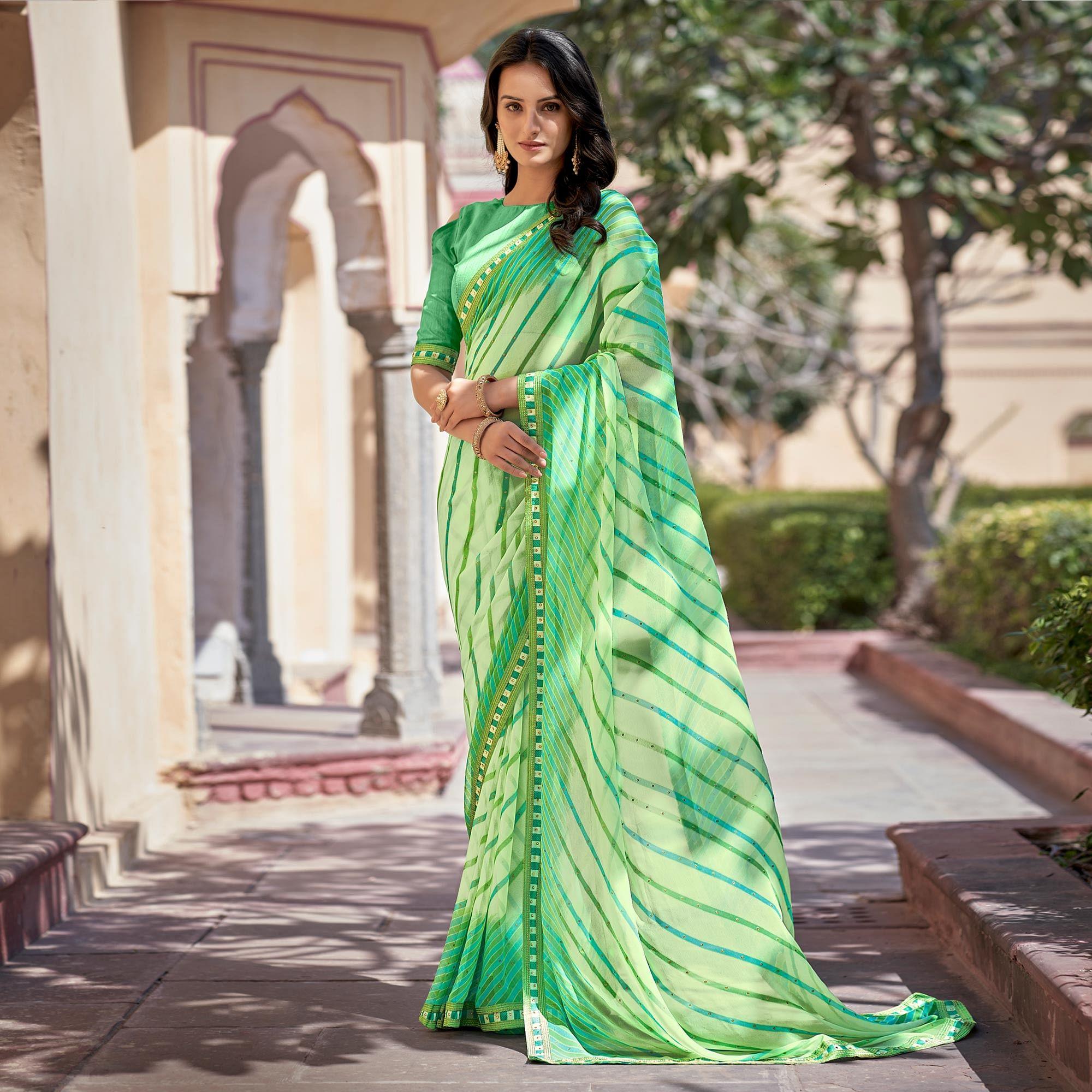 Green Printed With Embellished Georgette Saree - Peachmode