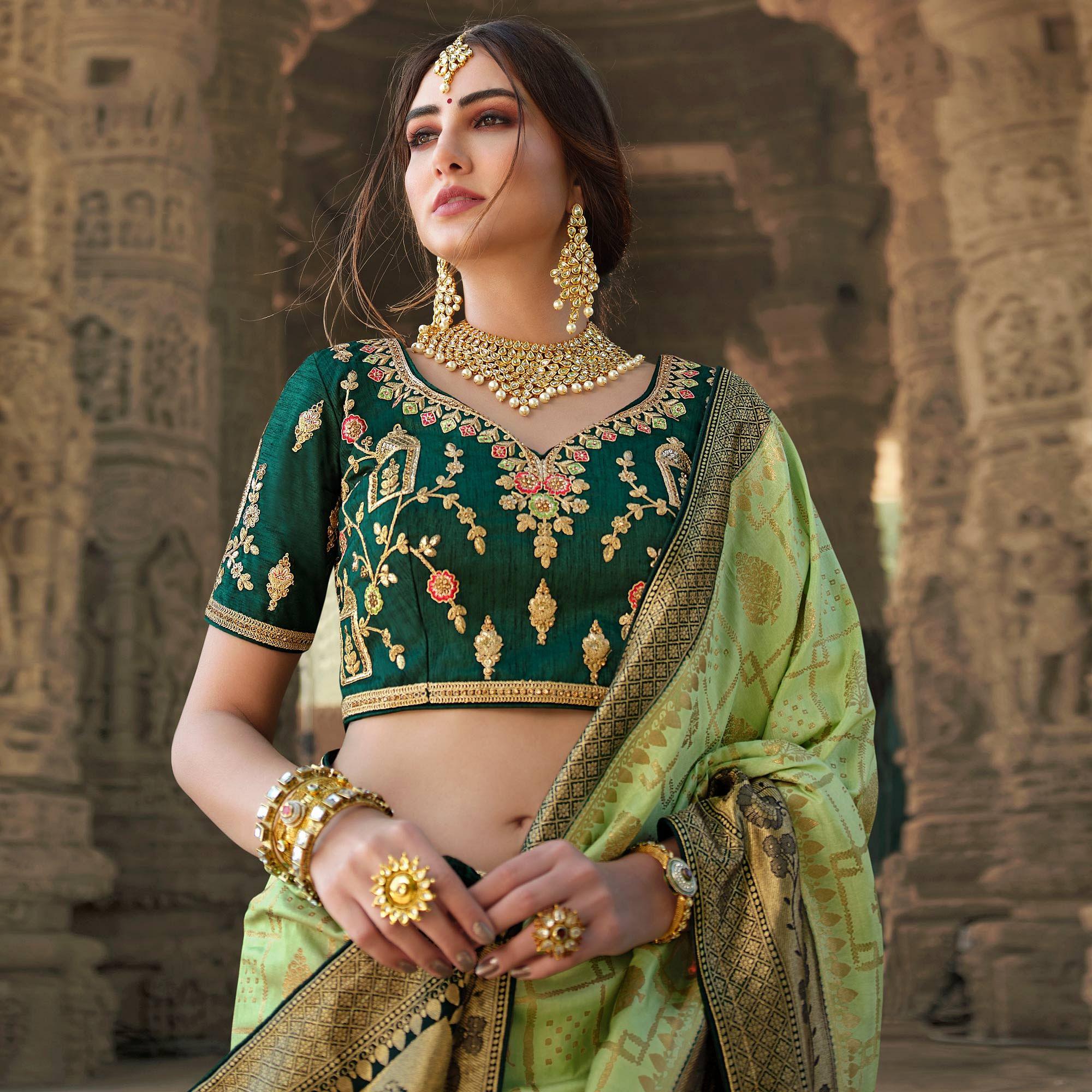 Green Wedding Wear Woven Silk Saree With Tassels - Peachmode