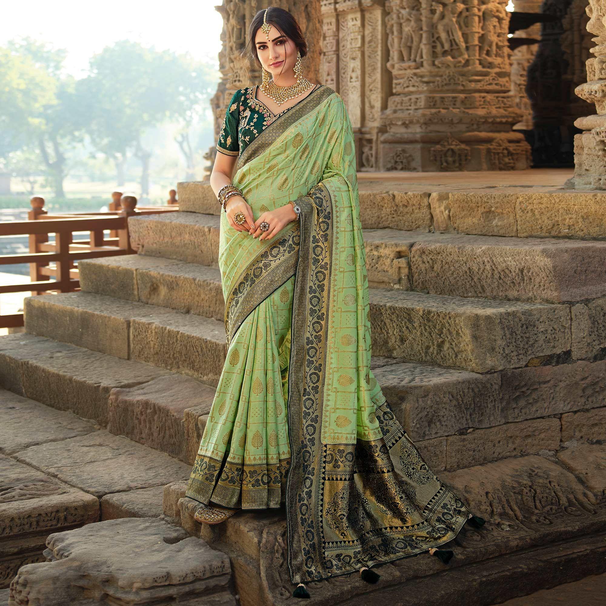 Green Wedding Wear Woven Silk Saree With Tassels - Peachmode