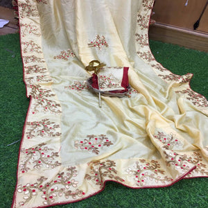 Hypnotic Cream Colored Festive Wear Butta Work Dola Silk Saree - Peachmode