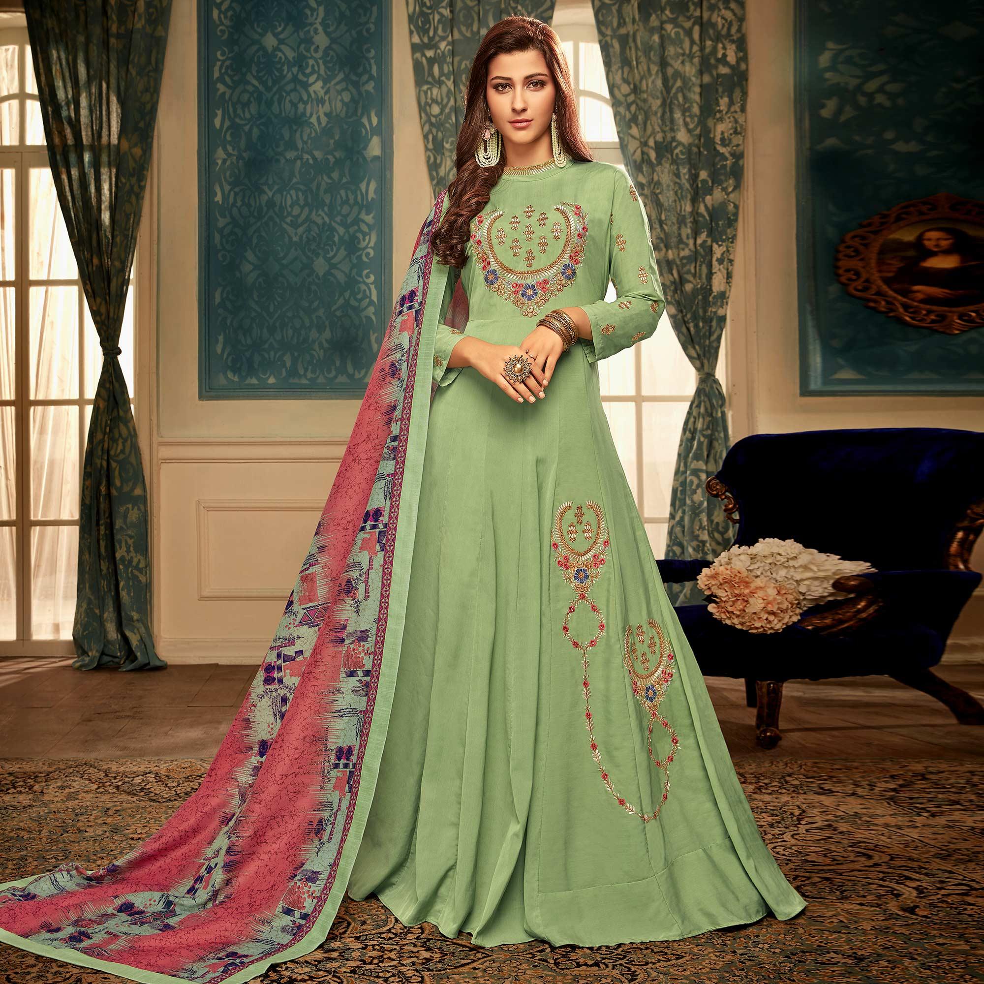 Hypnotic Pista Green Colored Partywear Embroidered Heavy Muslin Gown - Peachmode
