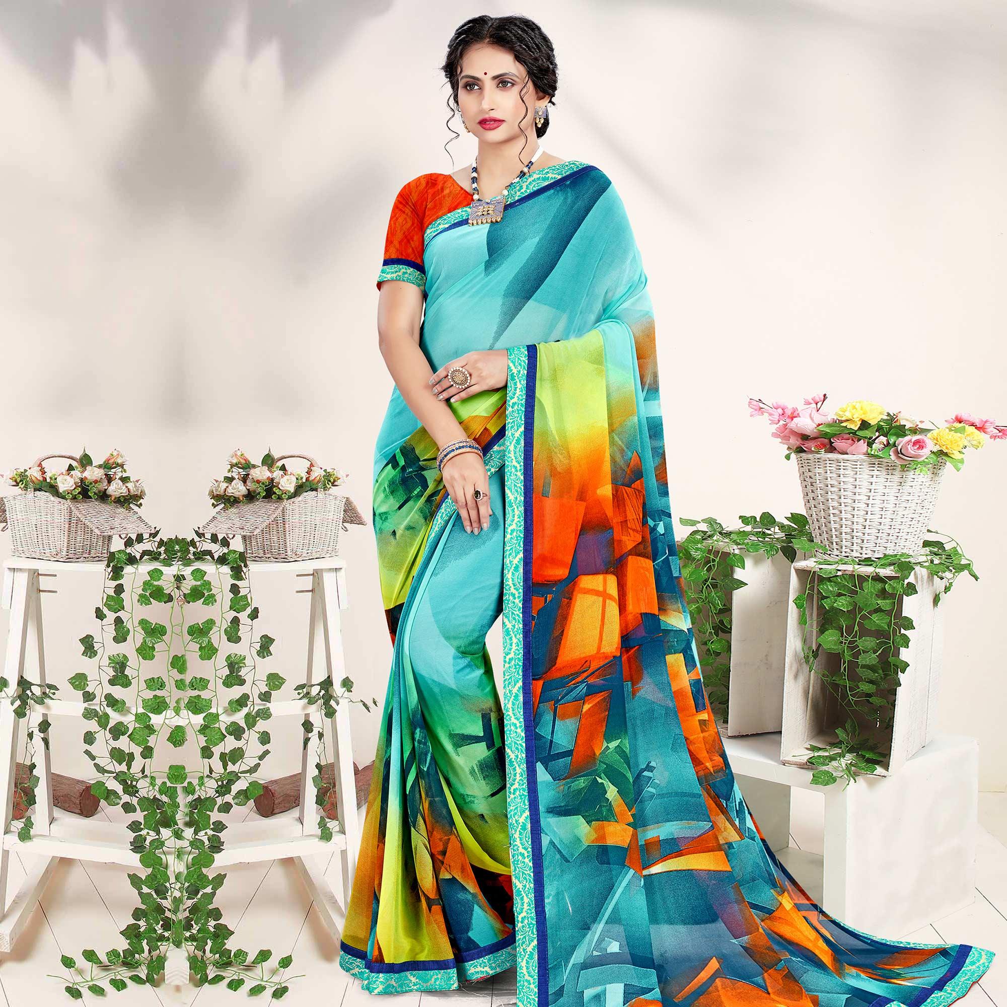 Imposing Blue Colored Casual Wear Printed Georgette Saree - Peachmode
