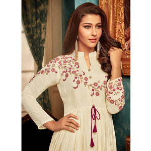 Imposing Cream Colored Partywear Embroidered Heavy Muslin Gown - Peachmode