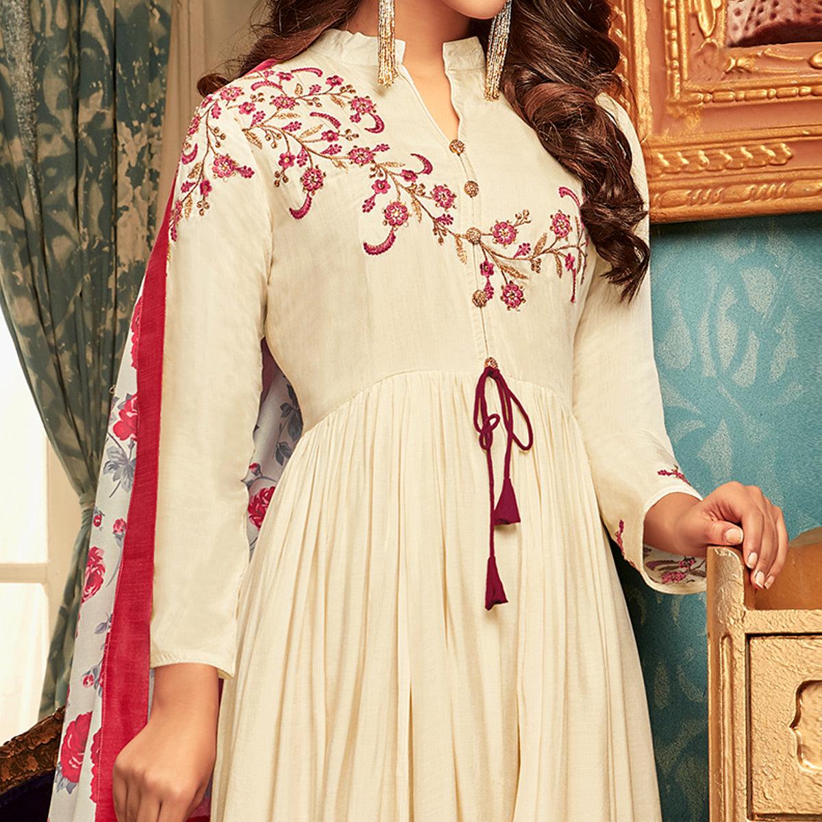 Imposing Cream Colored Partywear Embroidered Heavy Muslin Gown - Peachmode