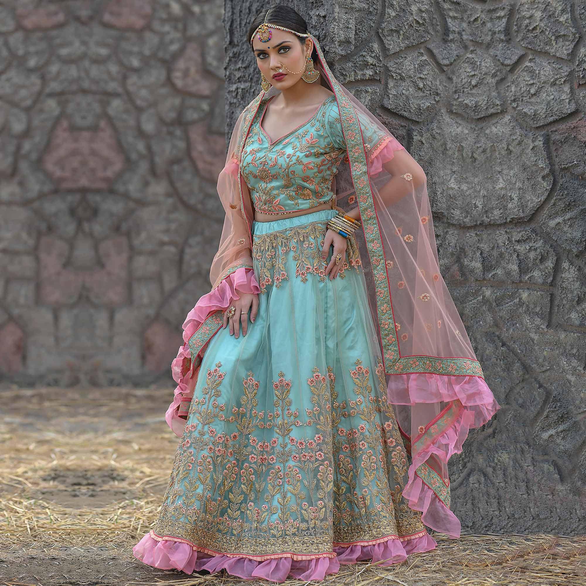 Imposing Turquoise Colored Party Wear Embroidered Net Lehenga Choli - Peachmode