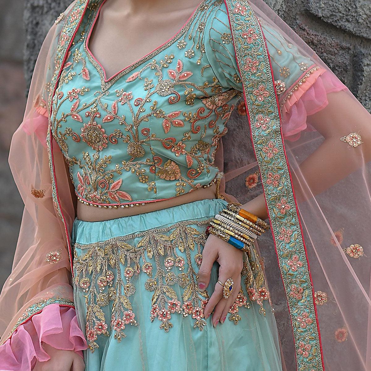 Imposing Turquoise Colored Party Wear Embroidered Net Lehenga Choli - Peachmode
