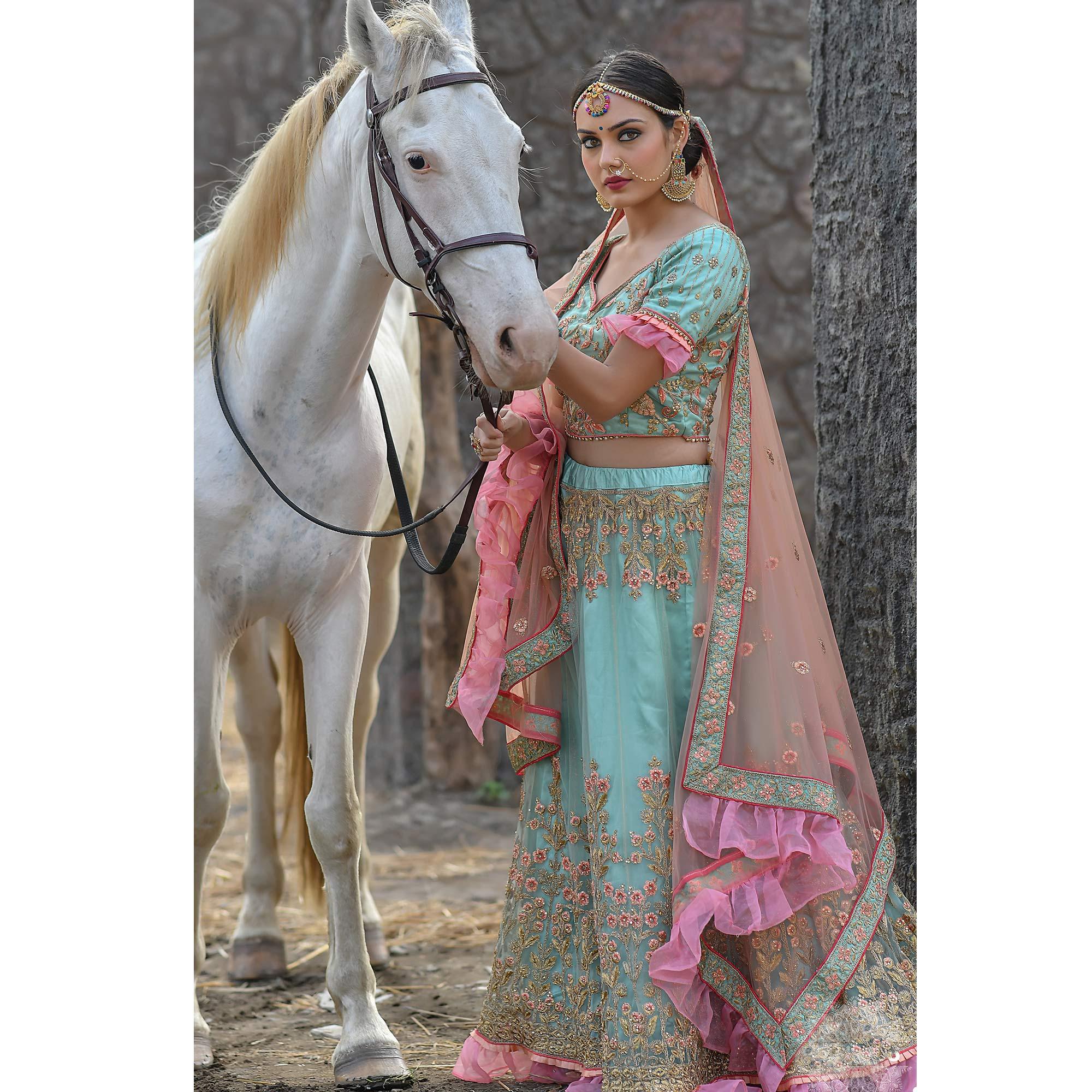 Imposing Turquoise Colored Party Wear Embroidered Net Lehenga Choli - Peachmode
