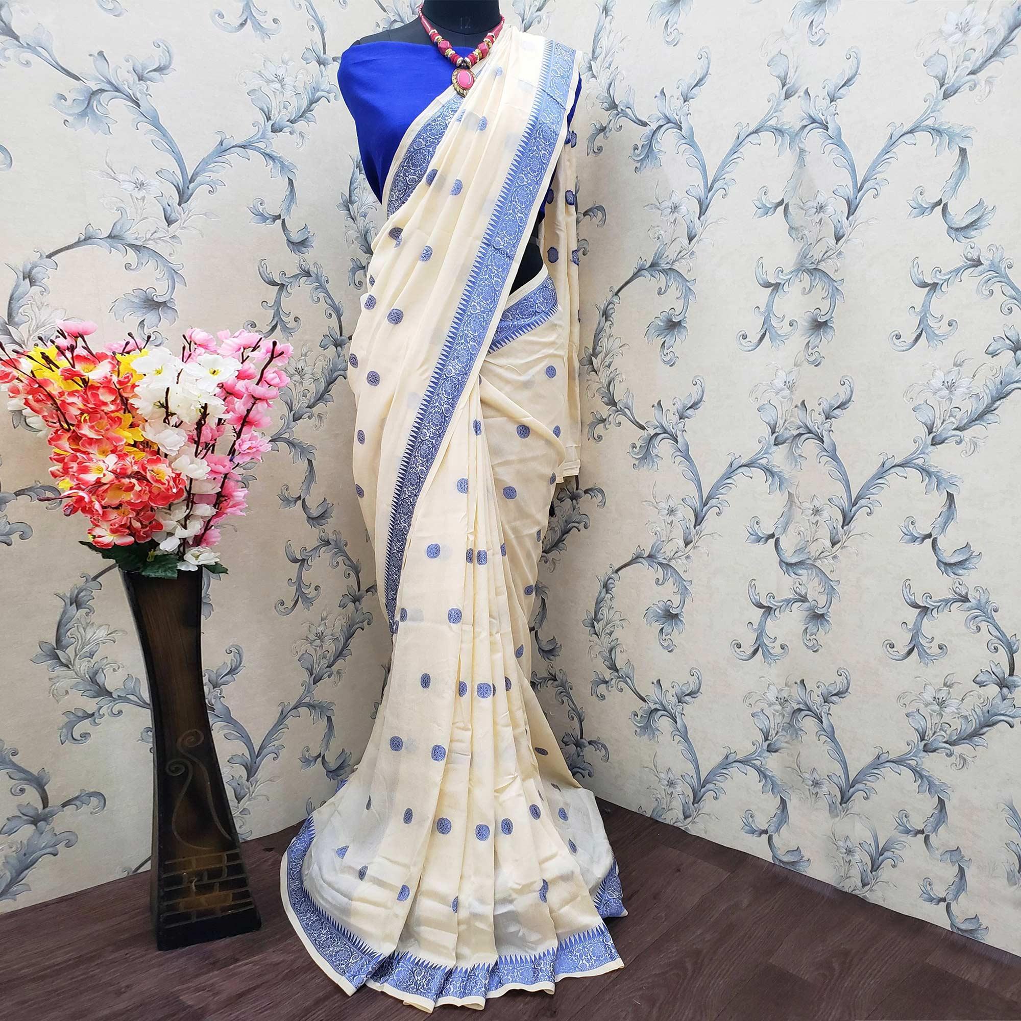 Impressive Cream Colored Festive Wear Woven Vichitra Silk Saree - Peachmode