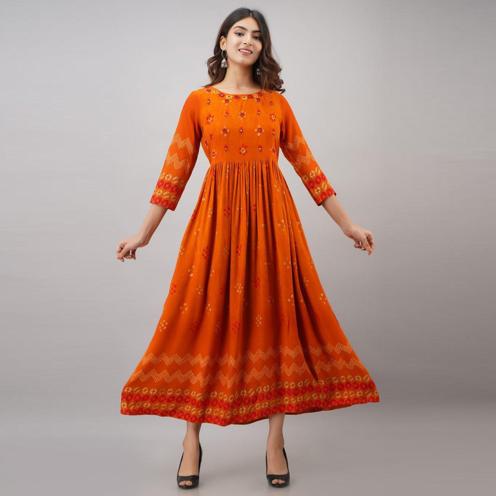 Impressive Orange Colored Partywear Embroidered Muslin Long Kurti - Peachmode