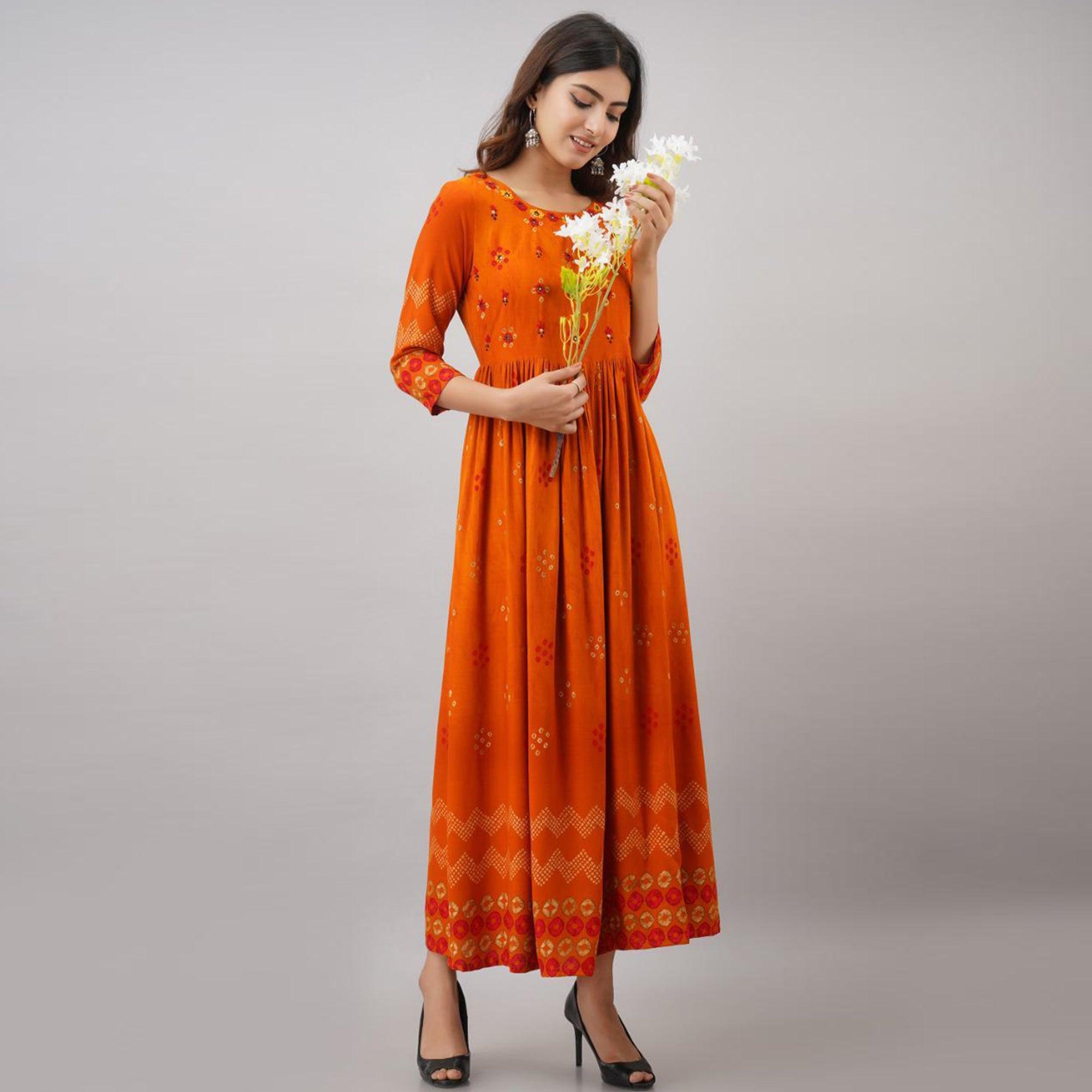Impressive Orange Colored Partywear Embroidered Muslin Long Kurti - Peachmode
