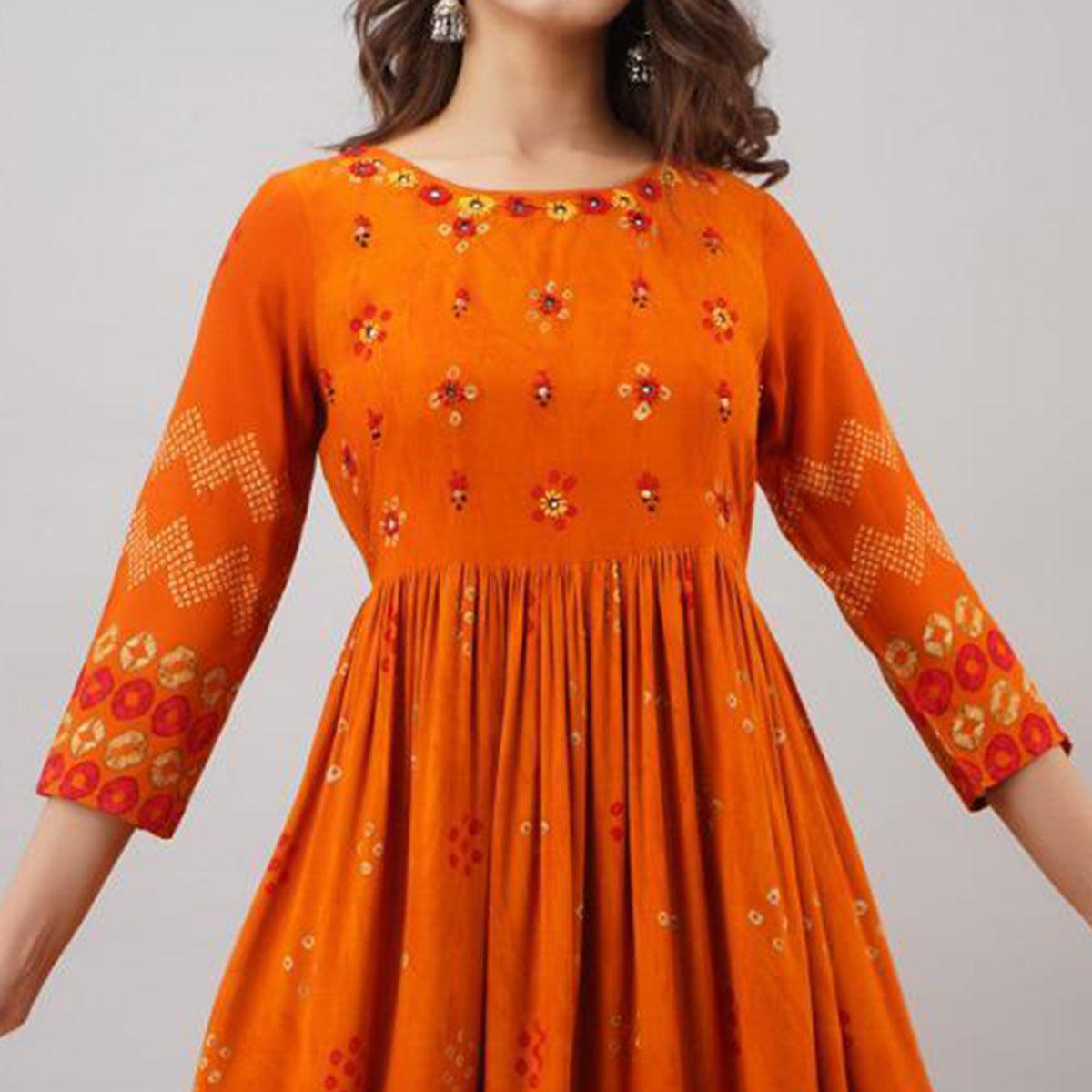 Impressive Orange Colored Partywear Embroidered Muslin Long Kurti - Peachmode