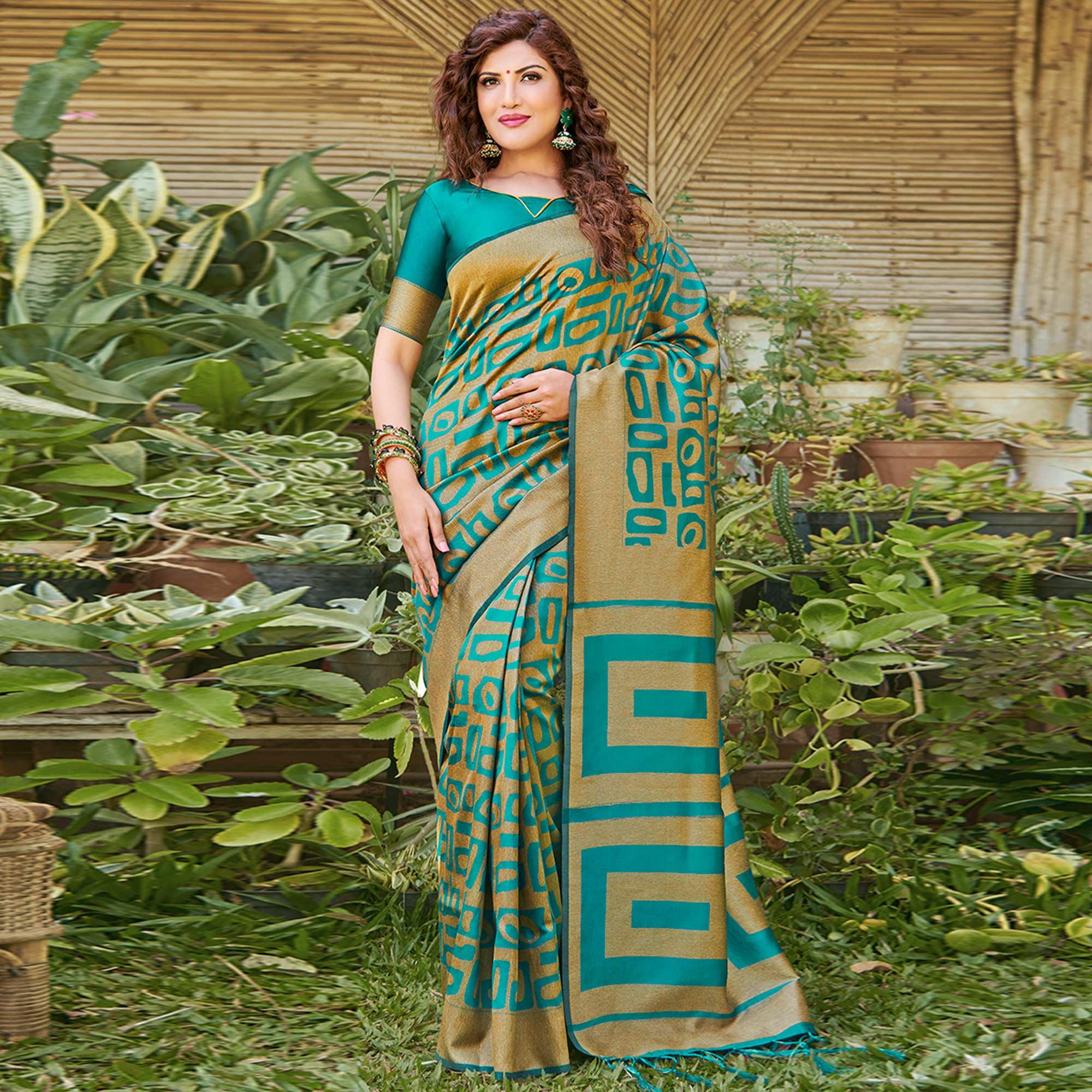Impressive Teal Blue Colored Festive Wear Floral Woven Silk Blend Saree With Tassels - Peachmode
