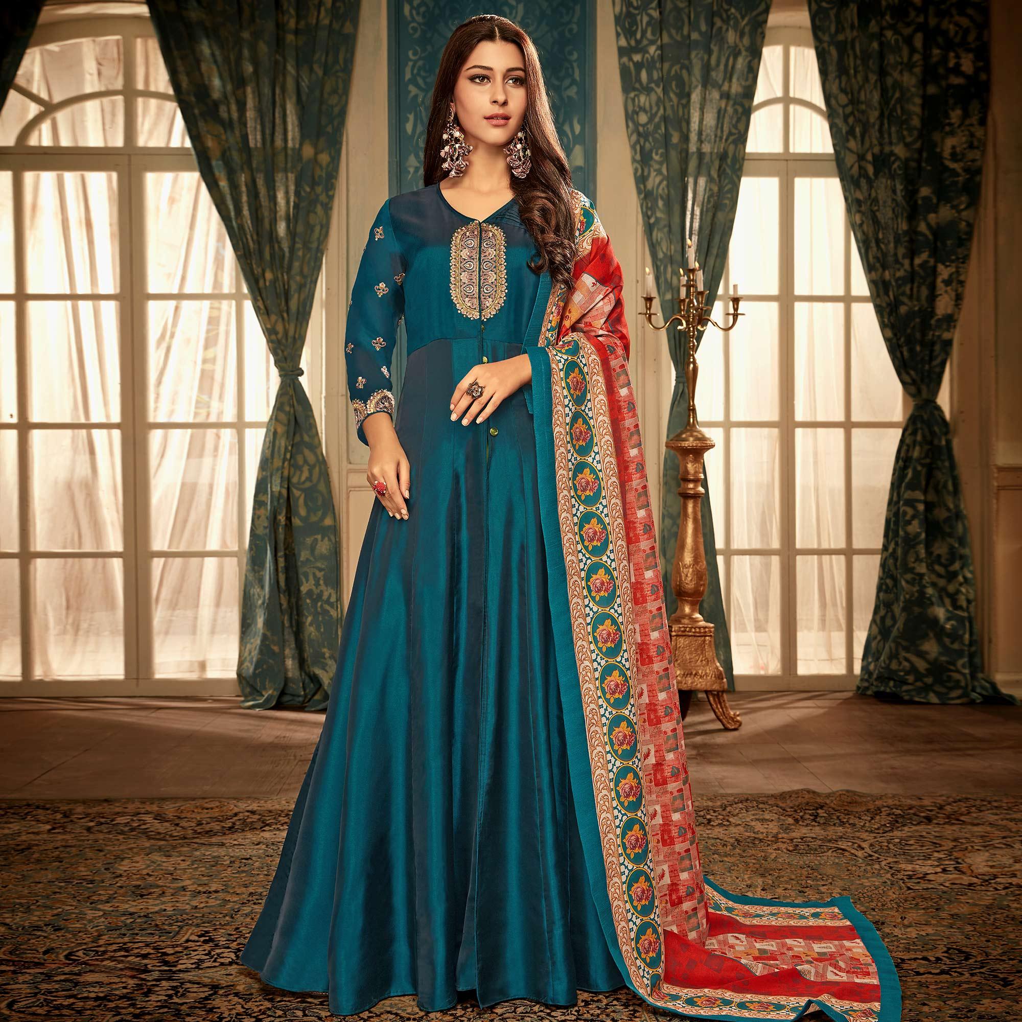 Impressive Teal Blue Colored Partywear Embroidered Heavy Muslin Gown - Peachmode