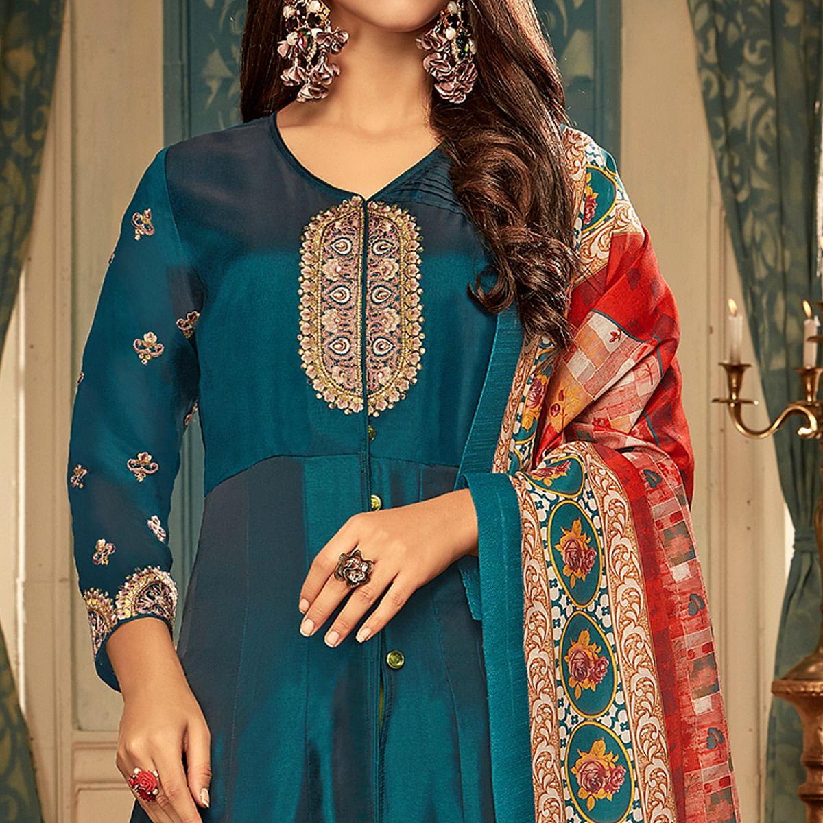Impressive Teal Blue Colored Partywear Embroidered Heavy Muslin Gown - Peachmode