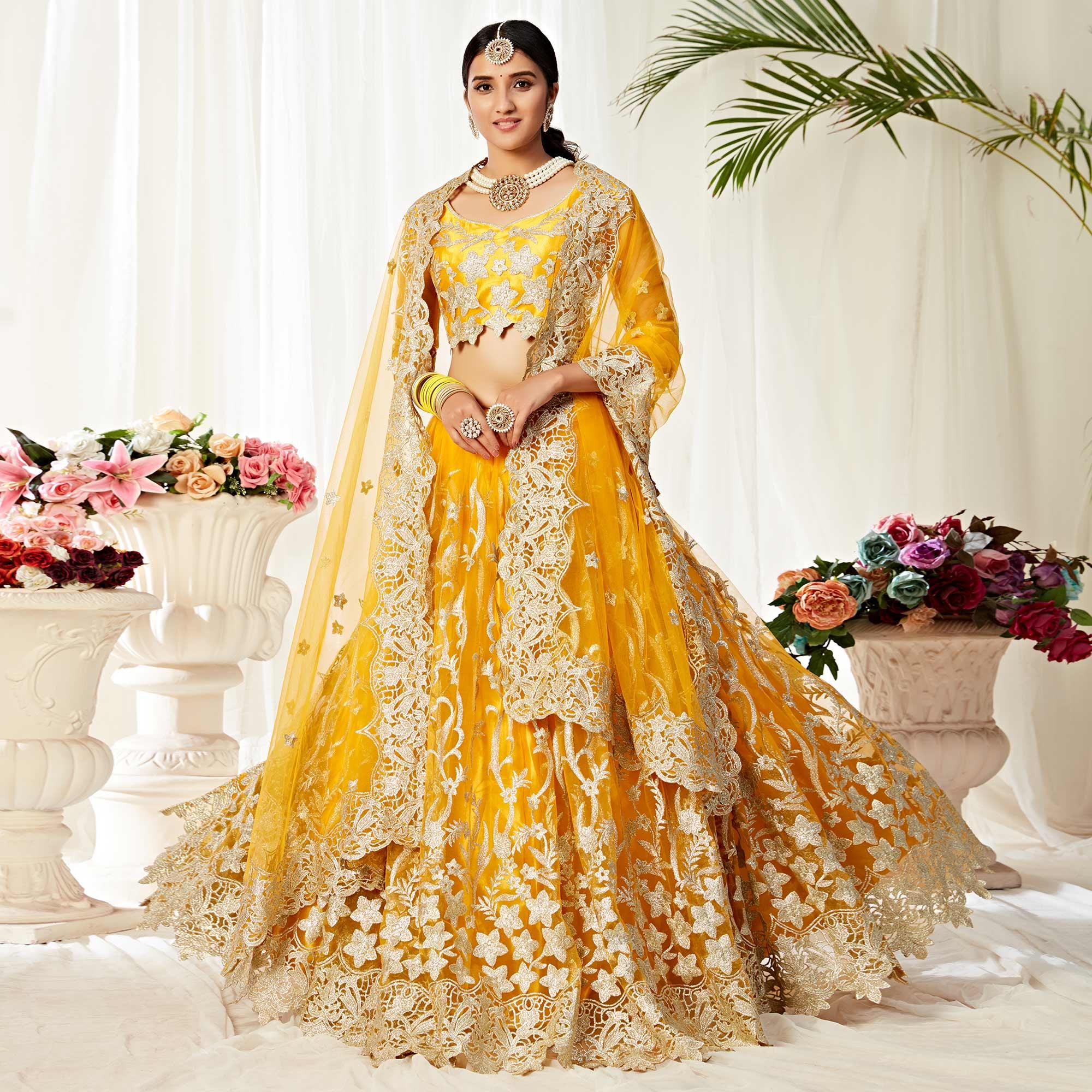 Impressive Yellow Colored Wedding Wear Embroidered Heavy Net Lehenga C