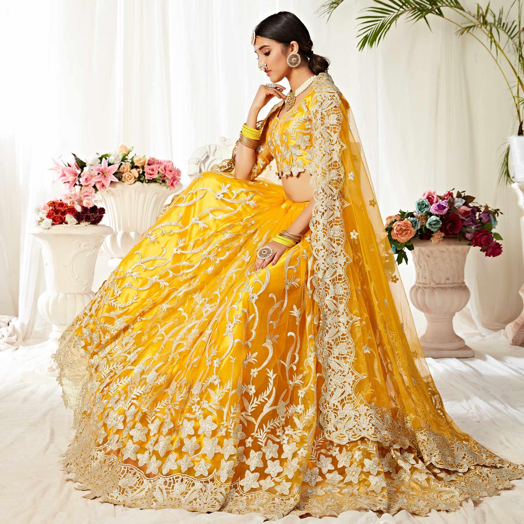 Impressive Yellow Colored Wedding Wear Embroidered Heavy Net Lehenga Choli - Peachmode