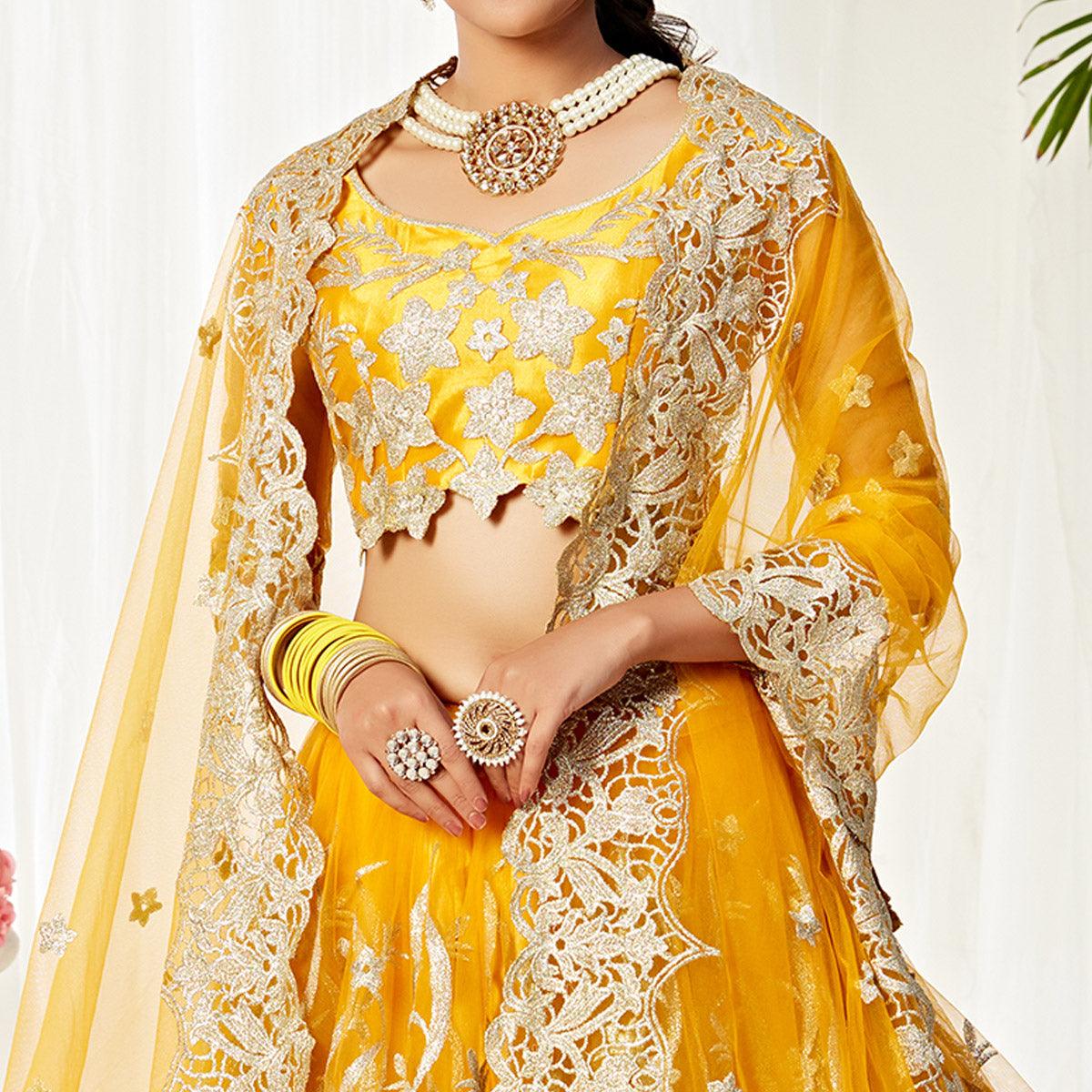 Impressive Yellow Colored Wedding Wear Embroidered Heavy Net Lehenga Choli - Peachmode