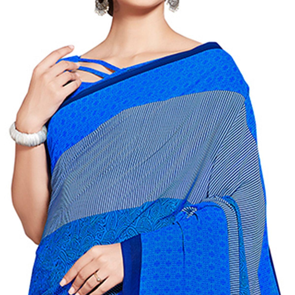 Innovative Blue Colored Casual Printed Georgette Saree - Peachmode