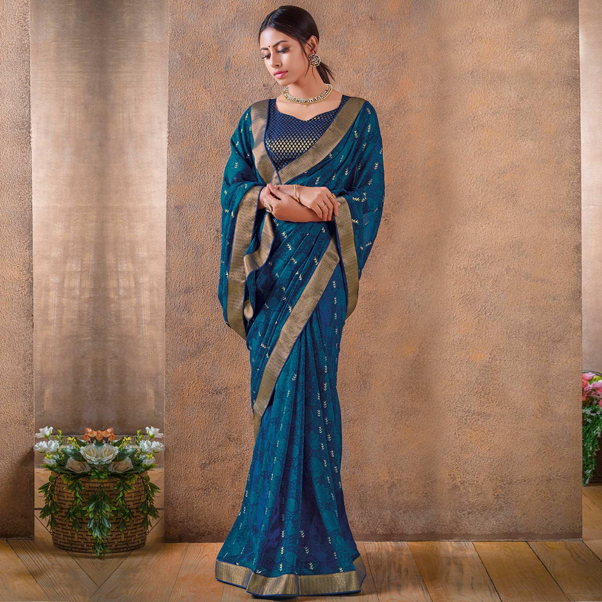 Innovative Blue Colored Festive Wear Foil Printed Georgette Saree - Peachmode