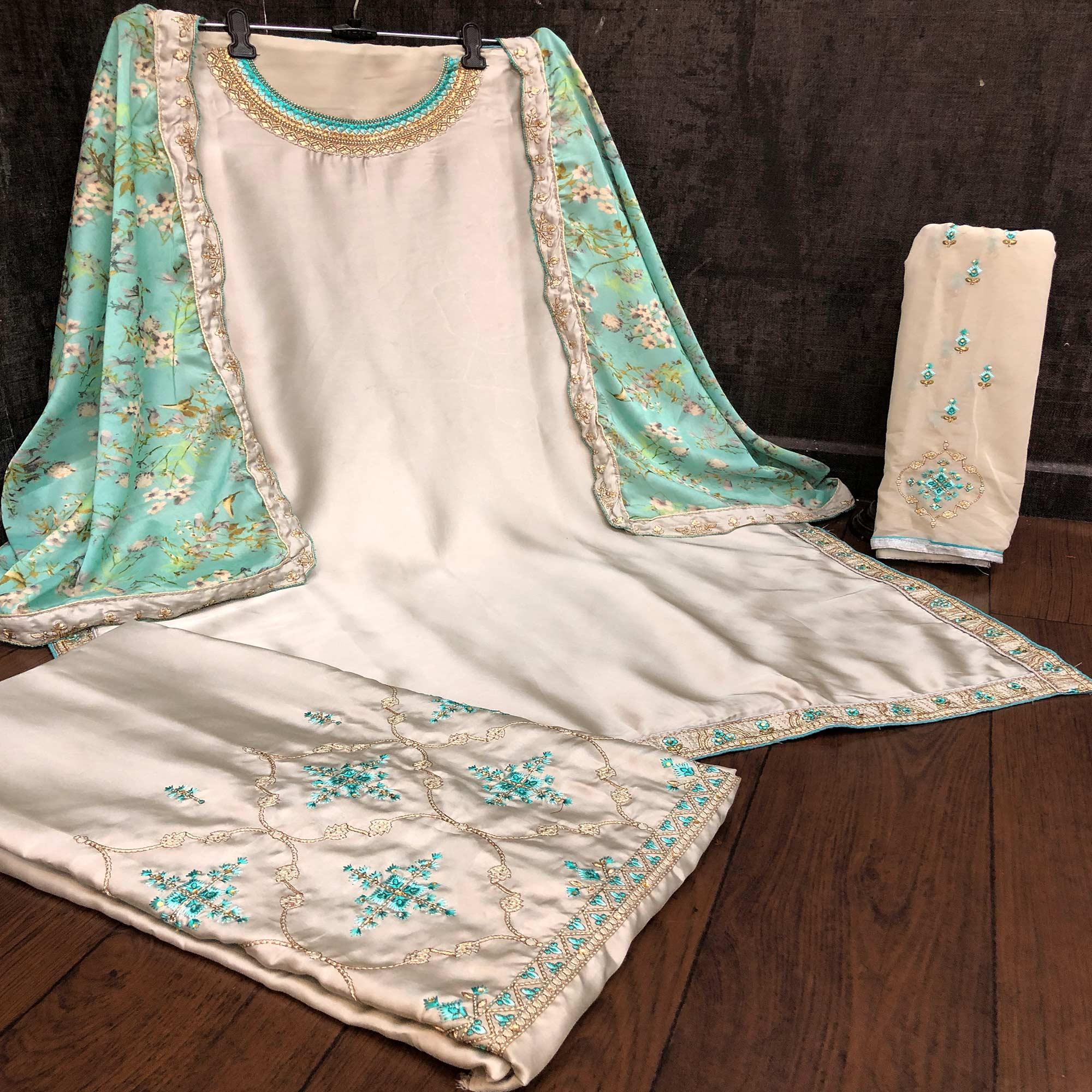 Innovative Grey Colored Partywear Embroidered Muslin Satin Gharara Suit With Palazzo - Peachmode