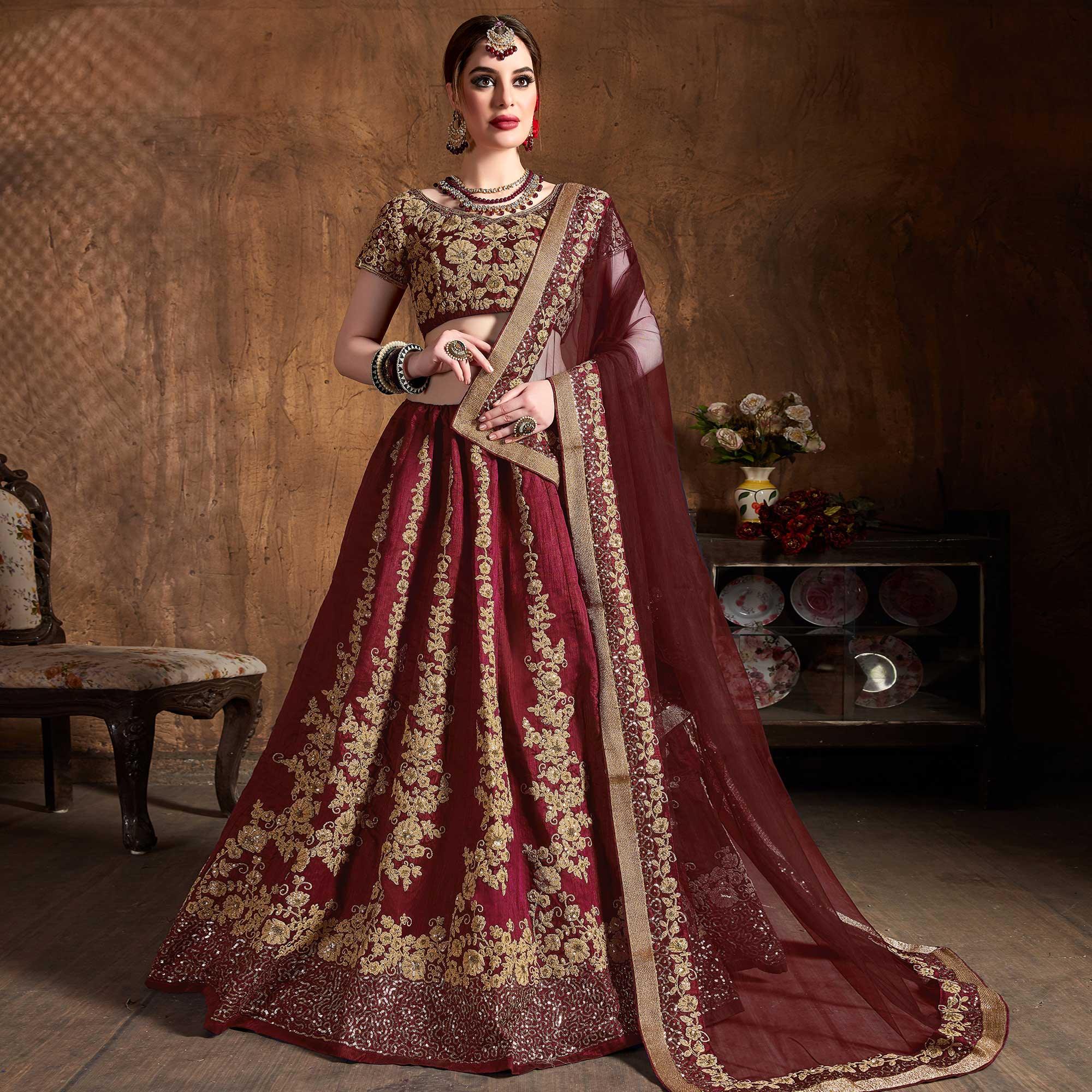 Innovative Maroon Colored Wedding Wear Embroidered Raw Silk Lehenga - Peachmode