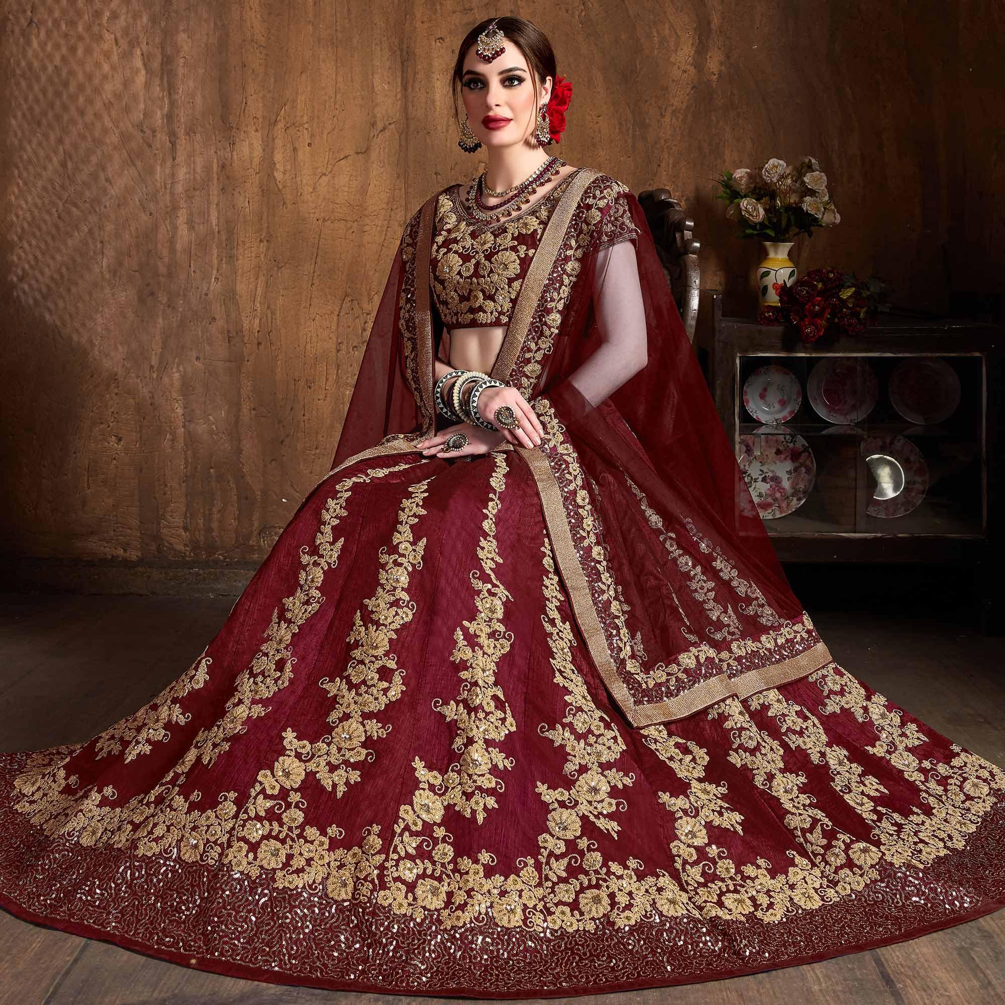 Innovative Maroon Colored Wedding Wear Embroidered Raw Silk Lehenga - Peachmode