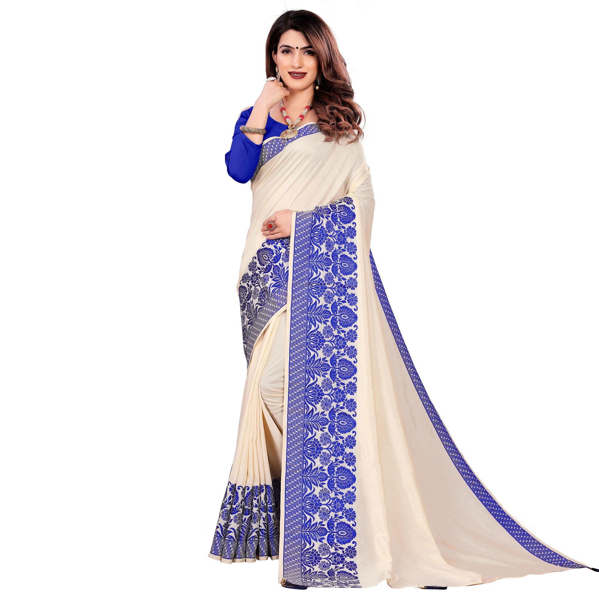 Intricate Cream Colored Festive Wear Woven Art Silk Saree With Tassels - Peachmode