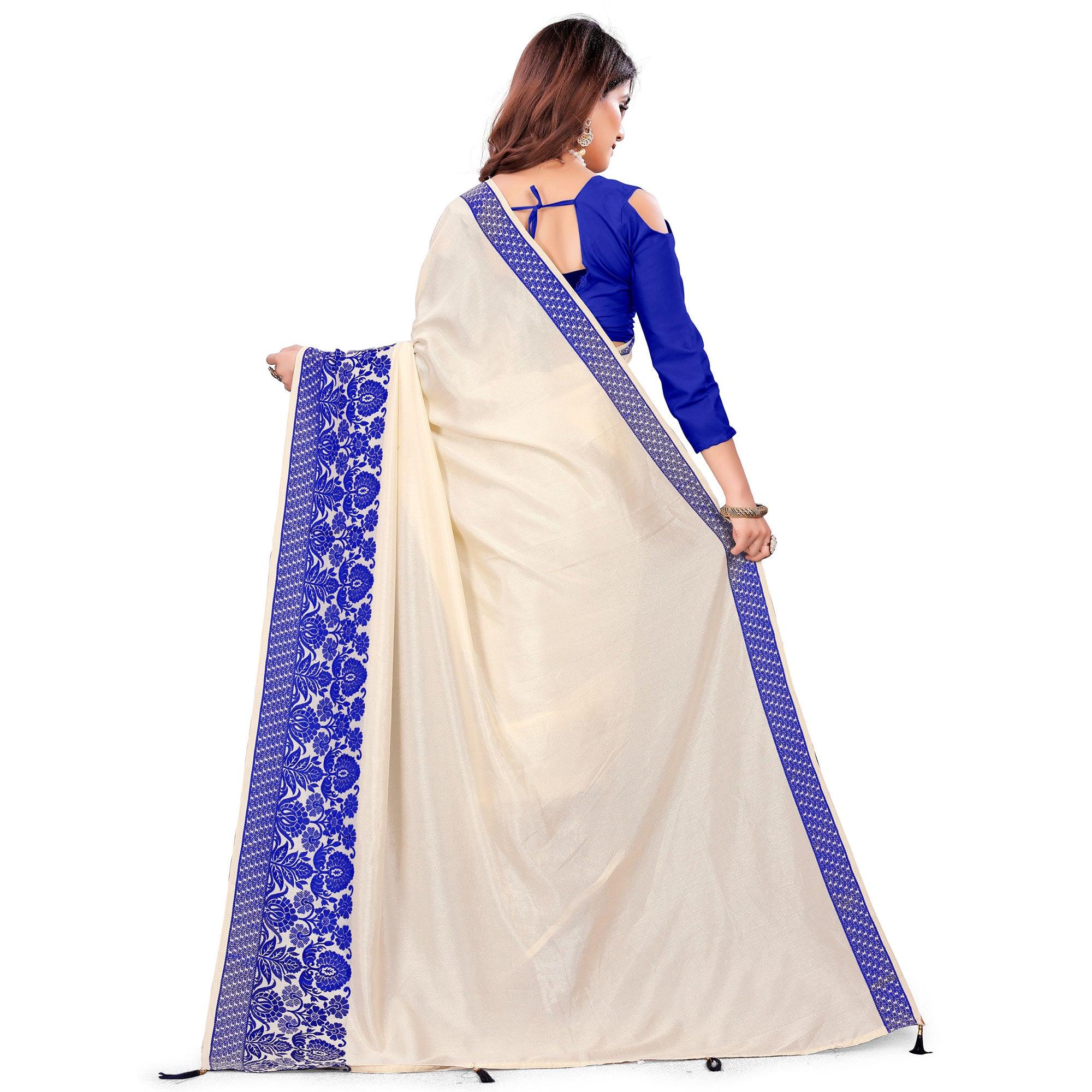 Intricate Cream Colored Festive Wear Woven Art Silk Saree With Tassels - Peachmode
