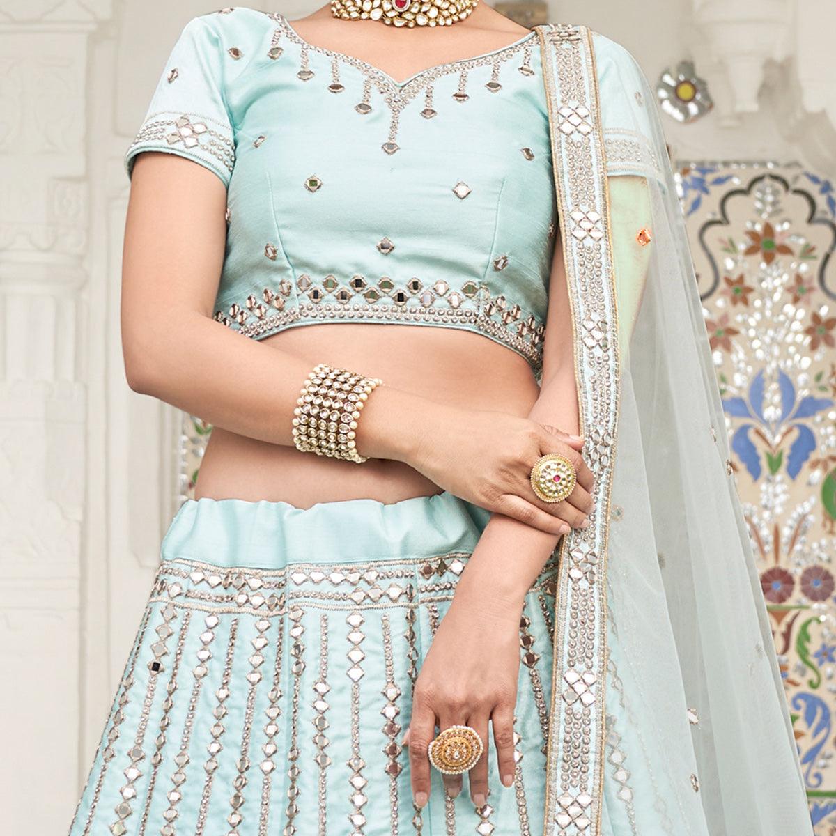 Intricate Ice Blue Coloured Wedding Wear Mirror Work Heavy Silk Lehenga Choli - Peachmode