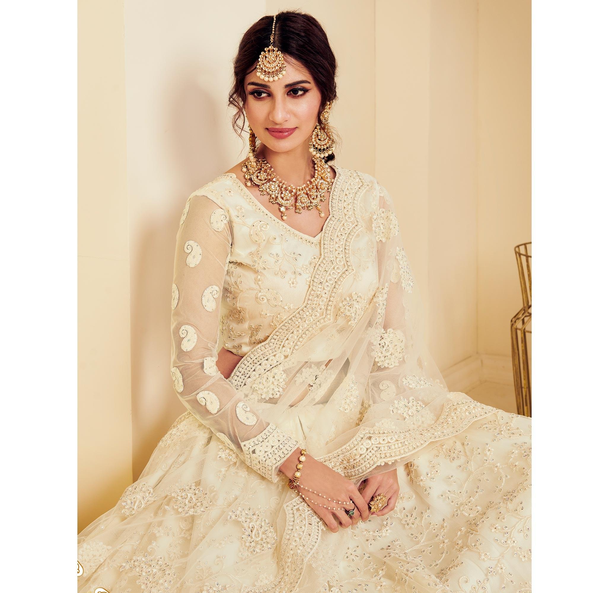 Intricate Off White Coloured Wedding Wear Cording Embroidered Net Lehenga Choli - Peachmode