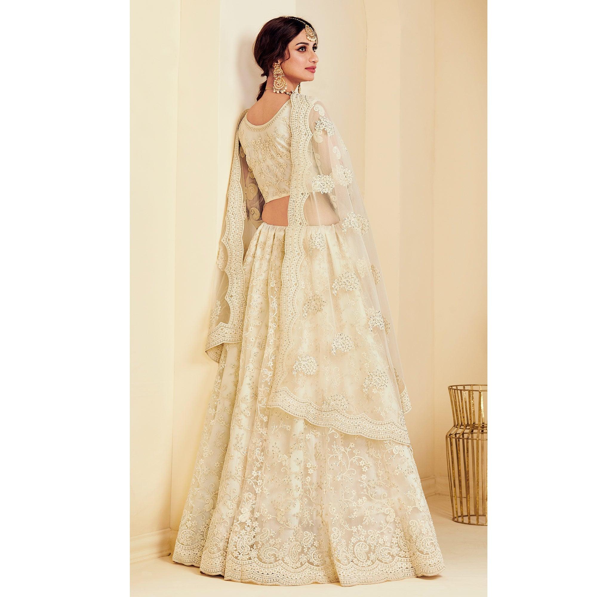 Intricate Off White Coloured Wedding Wear Cording Embroidered Net Lehenga Choli - Peachmode