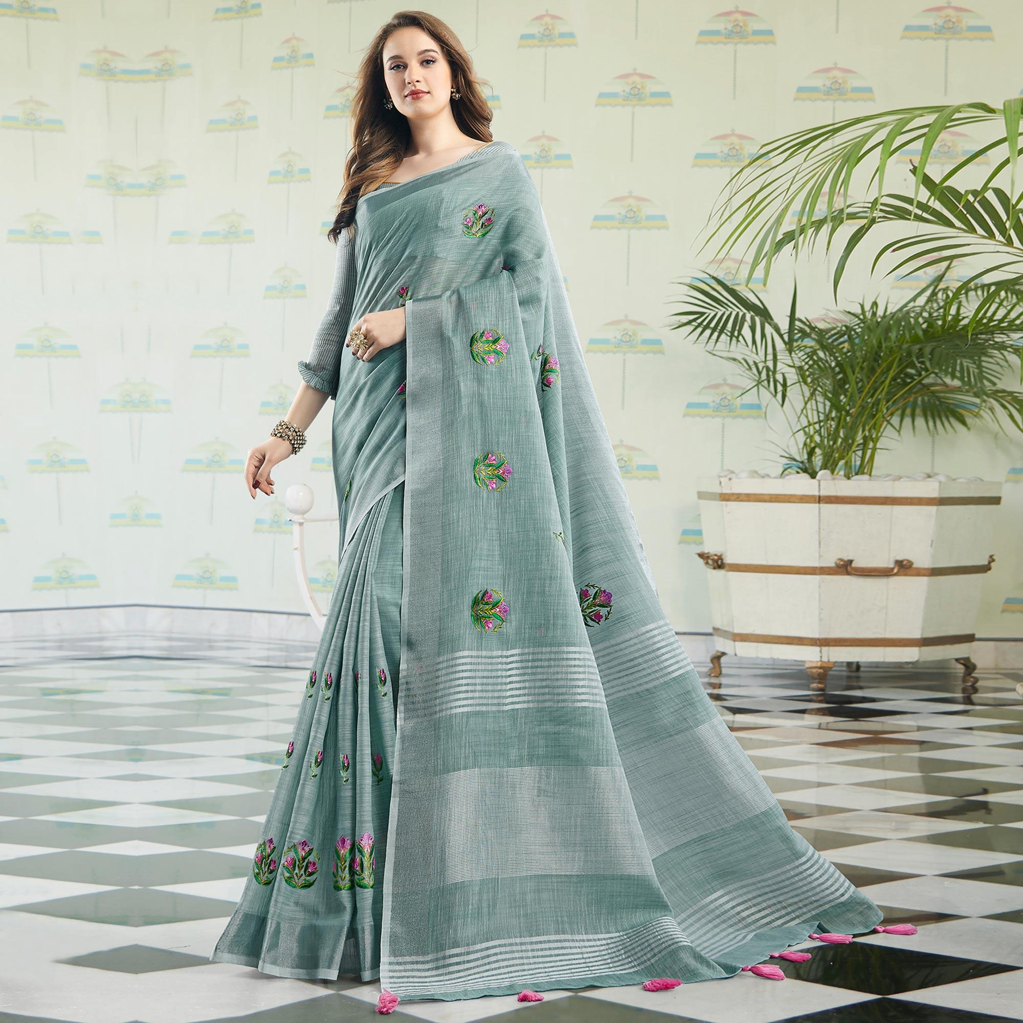 Intricate Pastel Blue Colored Casual Wear Floral Embroidered Linen-Cotton Saree With Tassels - Peachmode