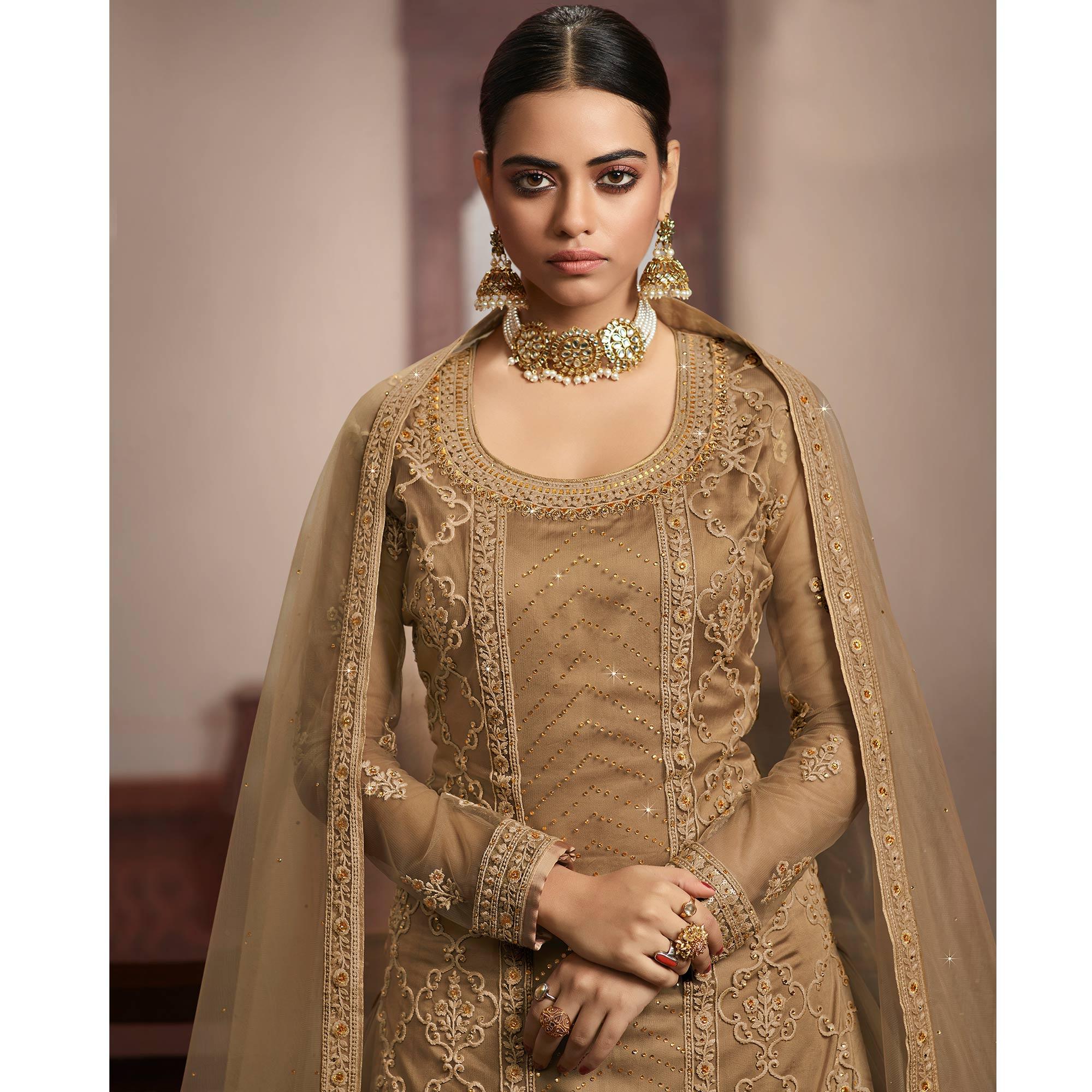 Jazzy Beige Coloured Partywear Embroidered Super Net Sharara Style Salwar Suit - Peachmode