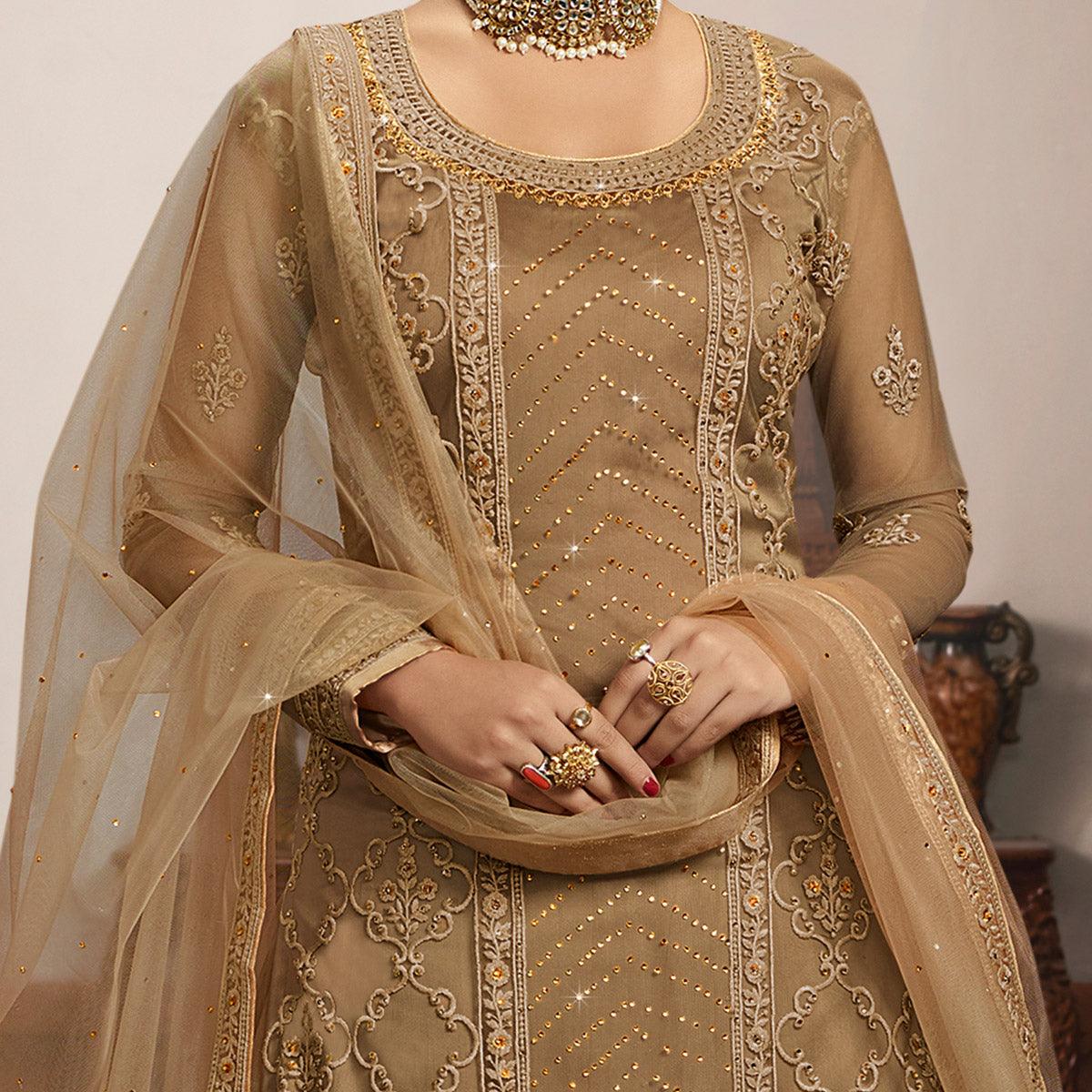 Jazzy Beige Coloured Partywear Embroidered Super Net Sharara Style Salwar Suit - Peachmode