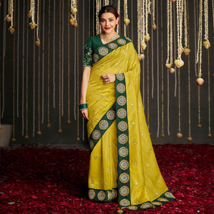 Lemon Green Woven With Embellished Art Silk Saree With Tassels - Peachmode