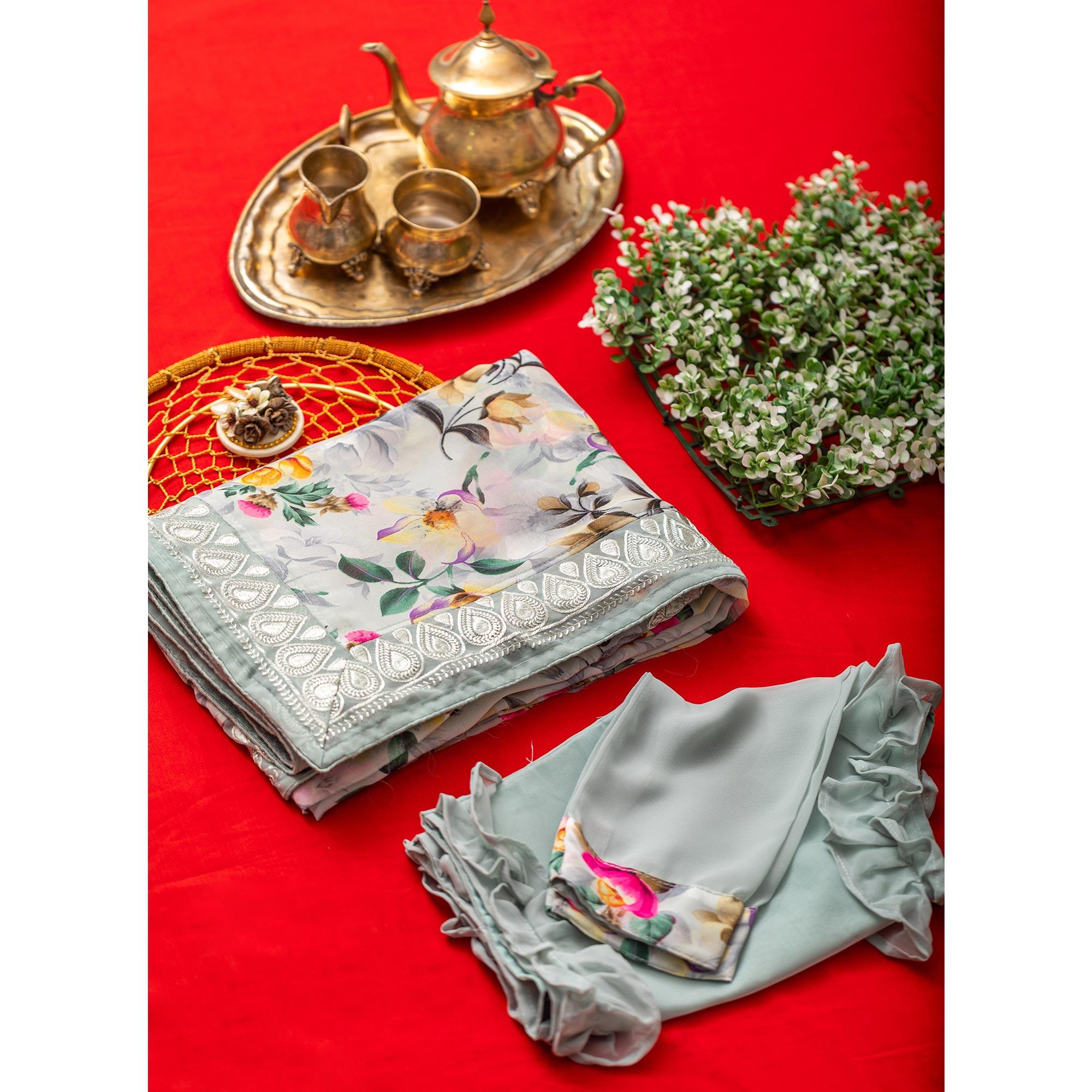 Light Blue Floral Printed With Embroidered Border Georgette Saree - Peachmode