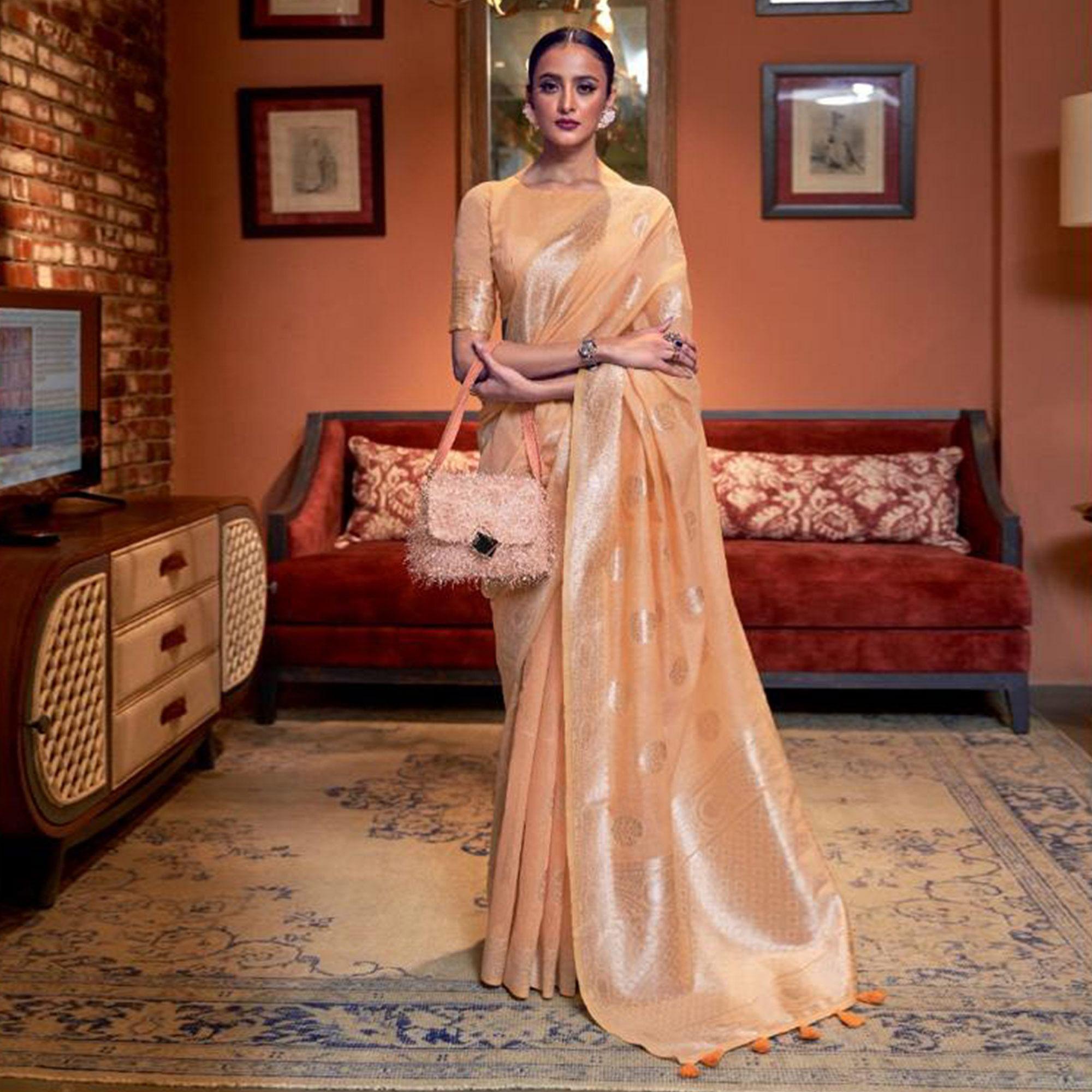 Light Orange Woven Linen Saree With Tassels - Peachmode