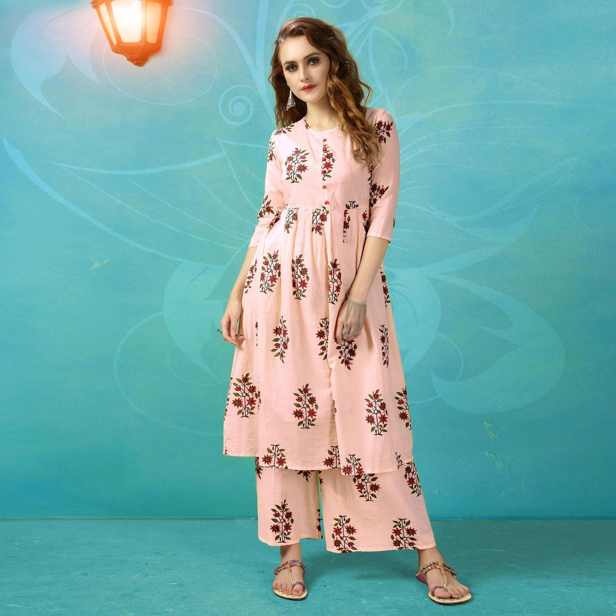 Adorning Pinkish Cream Colored Casual Wear Printed Cotton Palazzo Suit