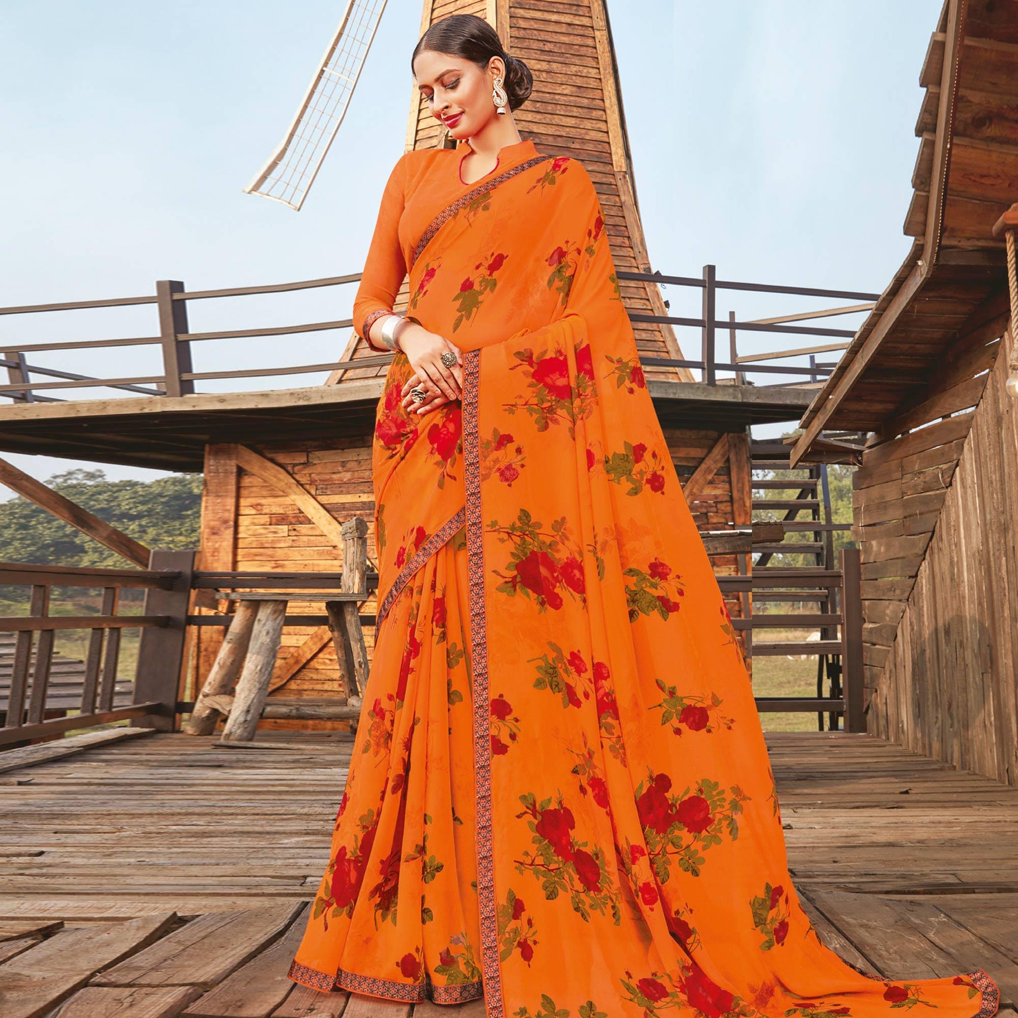 Lovely Orange Coloured Partywear Pure Georgette Floral Printed Saree With Fancy Lace Border - Peachmode