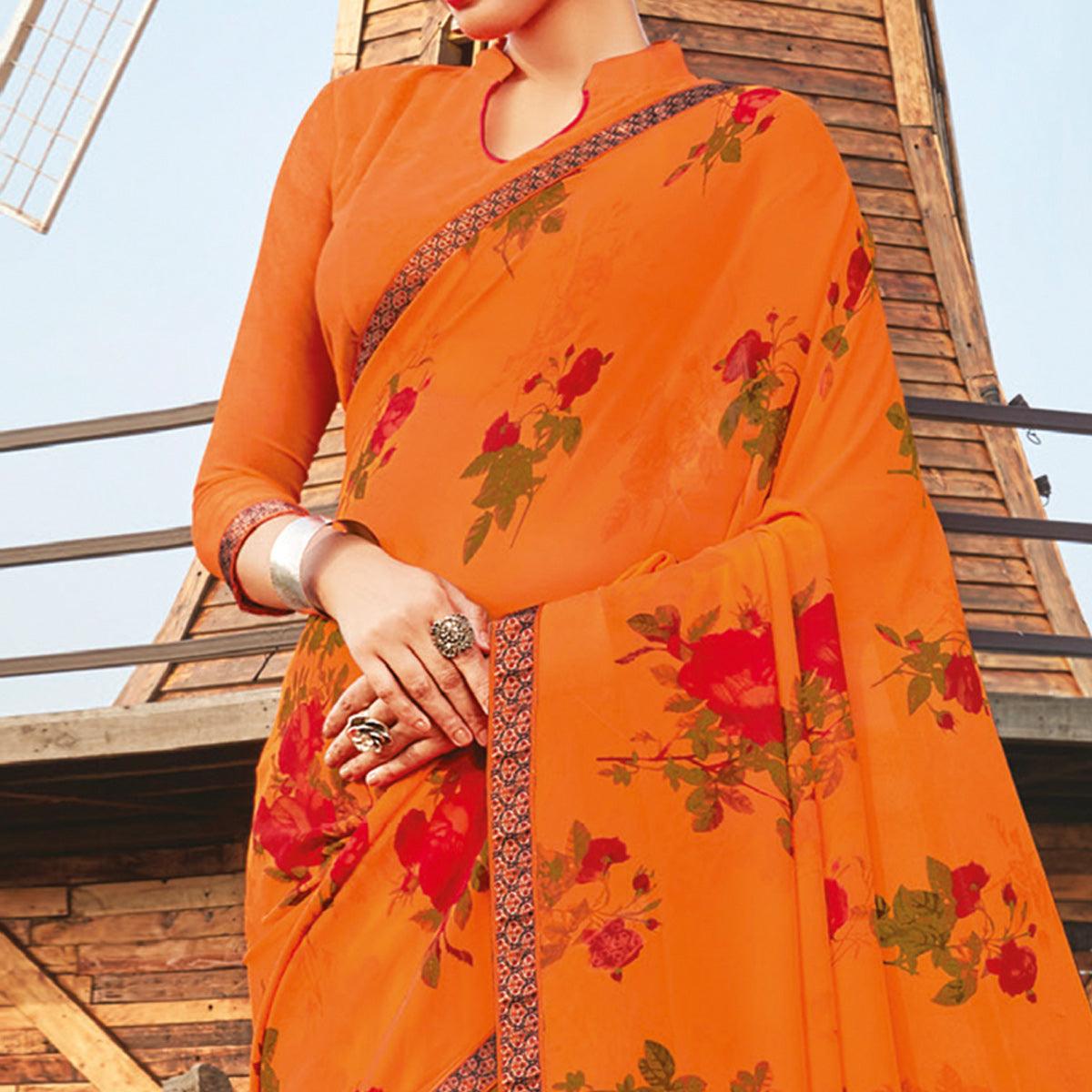 Lovely Orange Coloured Partywear Pure Georgette Floral Printed Saree With Fancy Lace Border - Peachmode