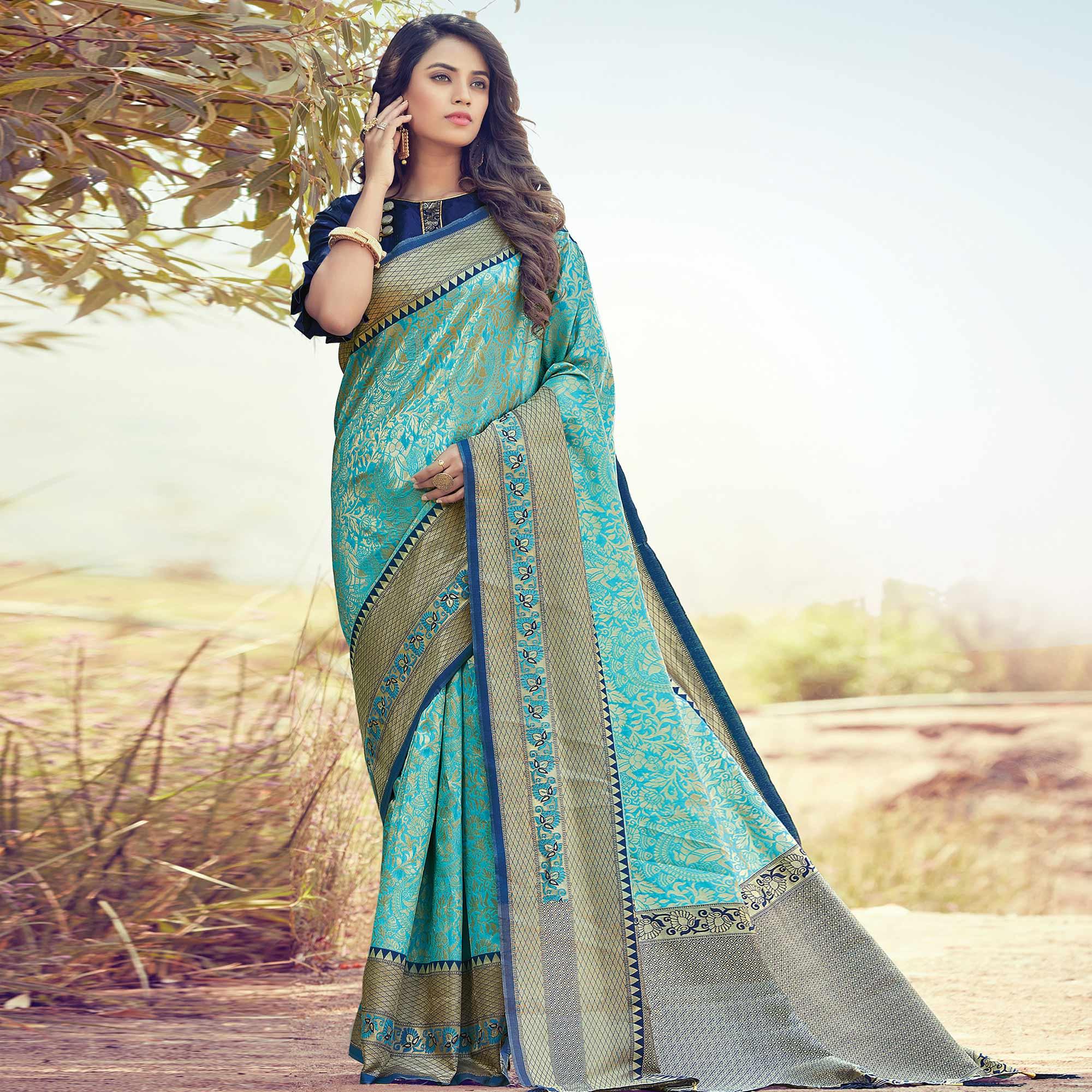 Lovely Turquoise Blue Colored Festive Wear Woven Silk Saree - Peachmode