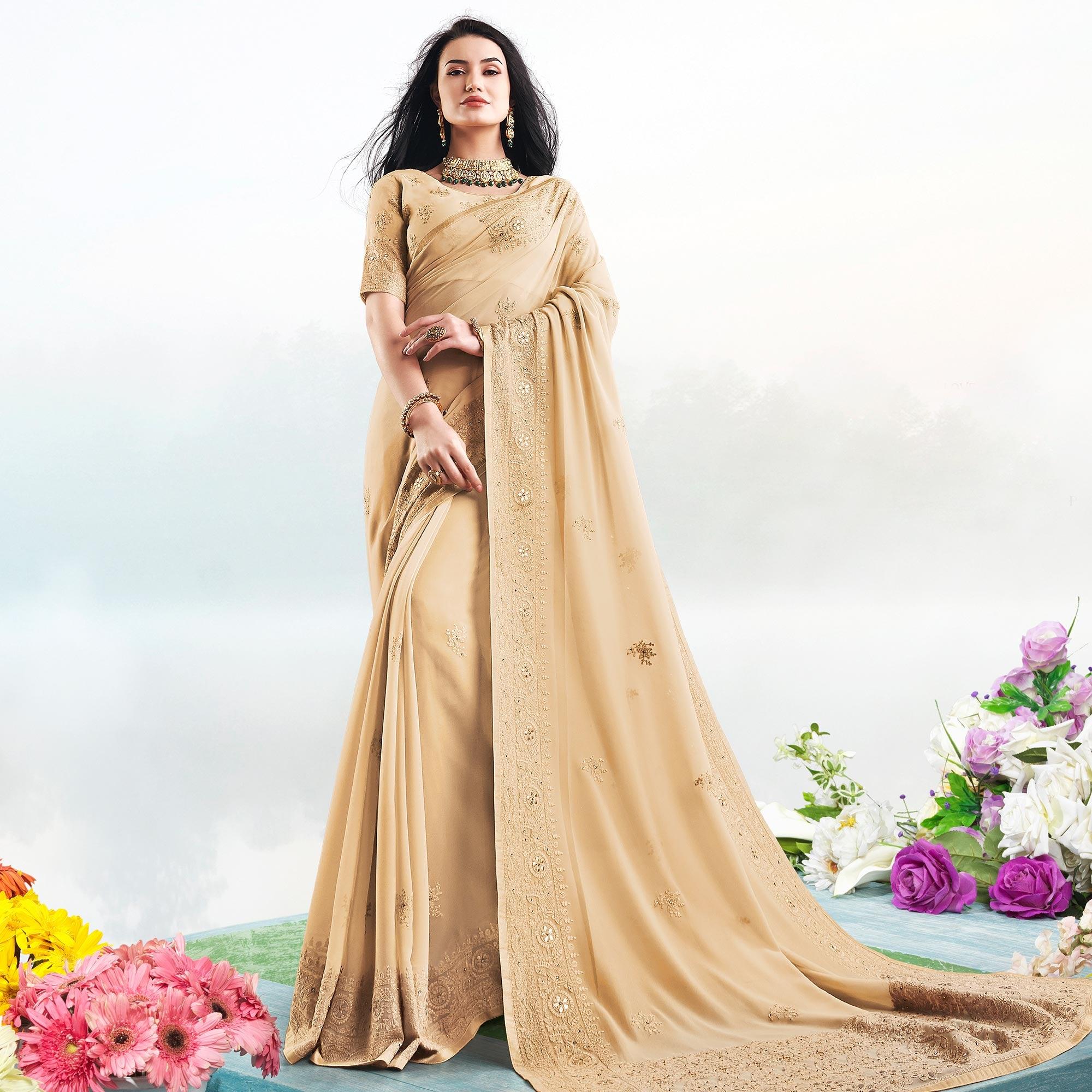 Magnetic Beige Colored Partywear Embroidered Georgette Saree - Peachmode