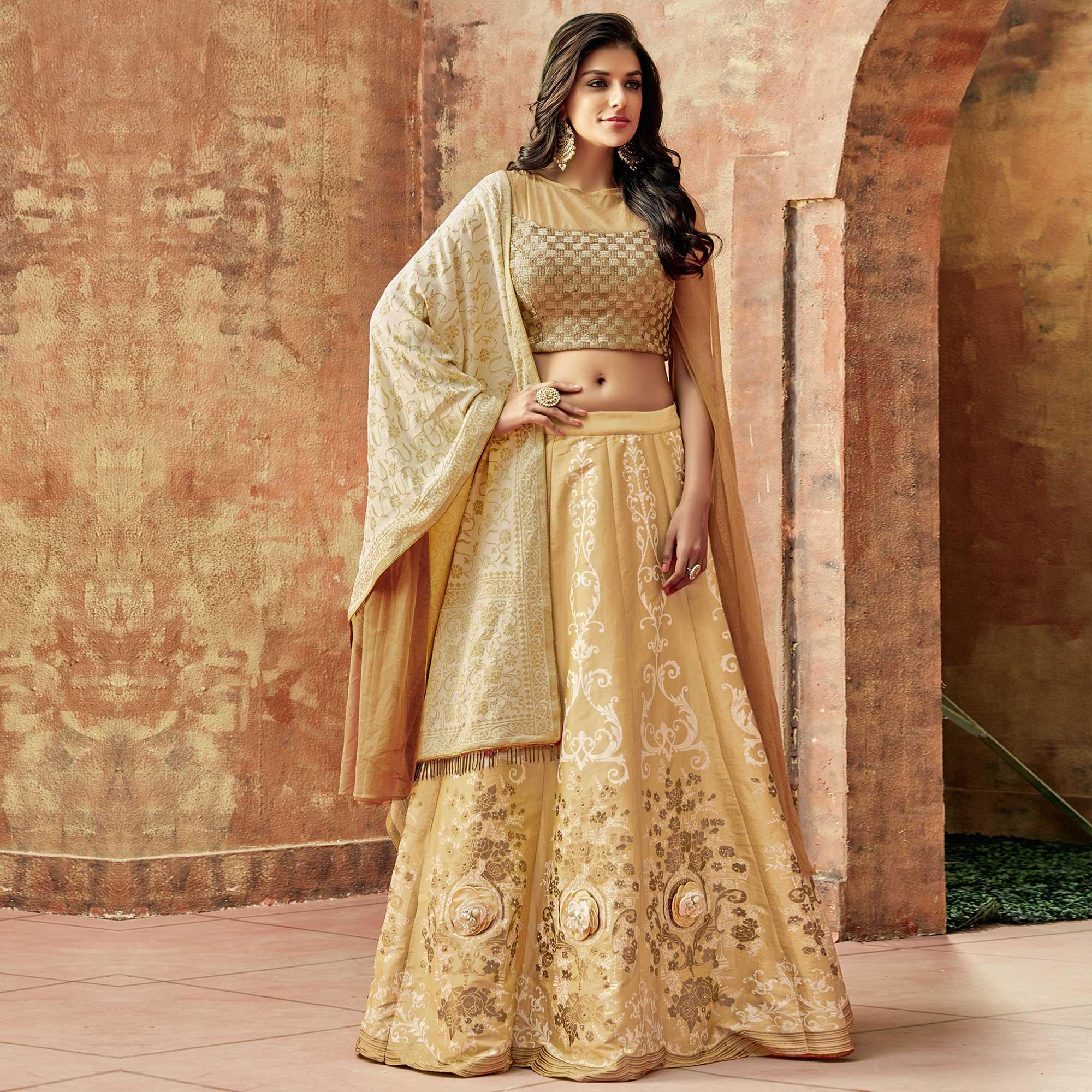 Magnetic Beige Colored Partywear Embroidered Silk Lehenga Choli - Peachmode