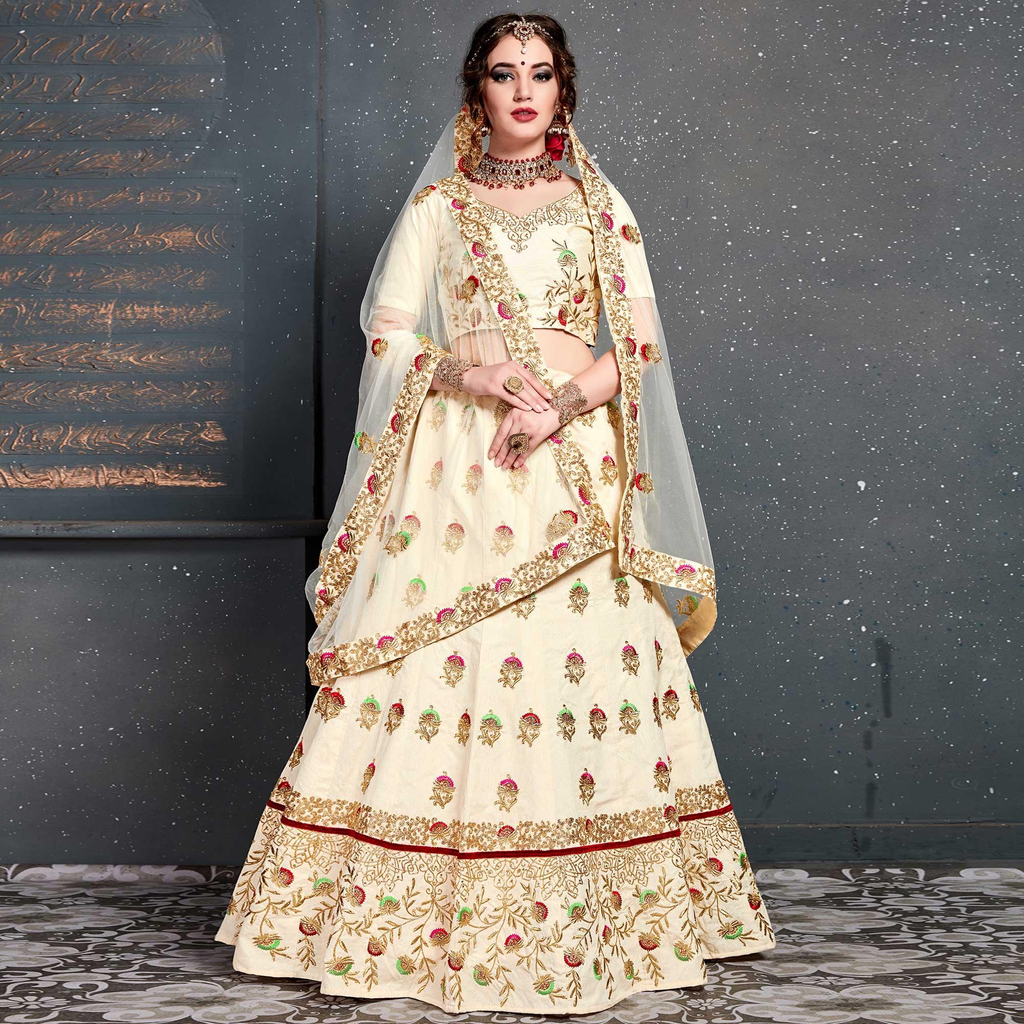 Magnetic Cream Colored Wedding Wear Embroidered Silk Lehenga Choli - Peachmode