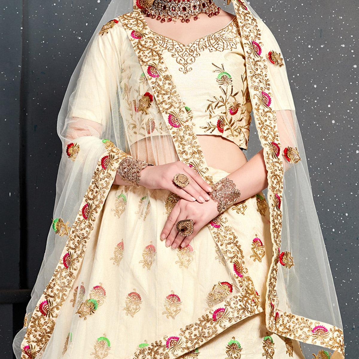 Magnetic Cream Colored Wedding Wear Embroidered Silk Lehenga Choli - Peachmode