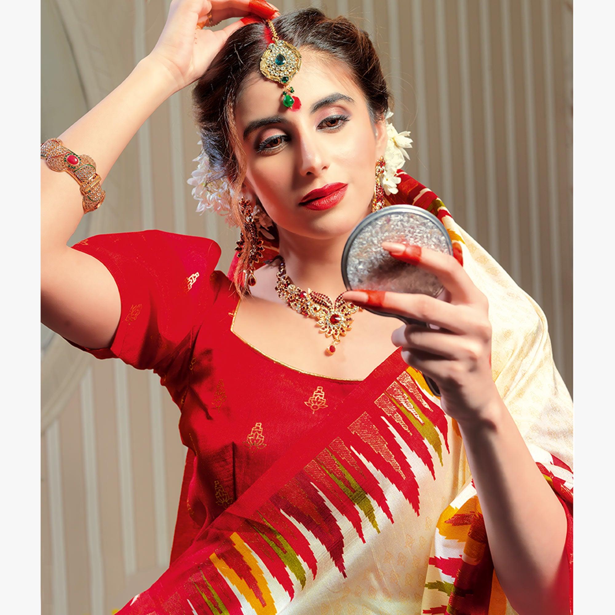 Majesty Cream Colored Festive Wear Patola Silk saree - Peachmode