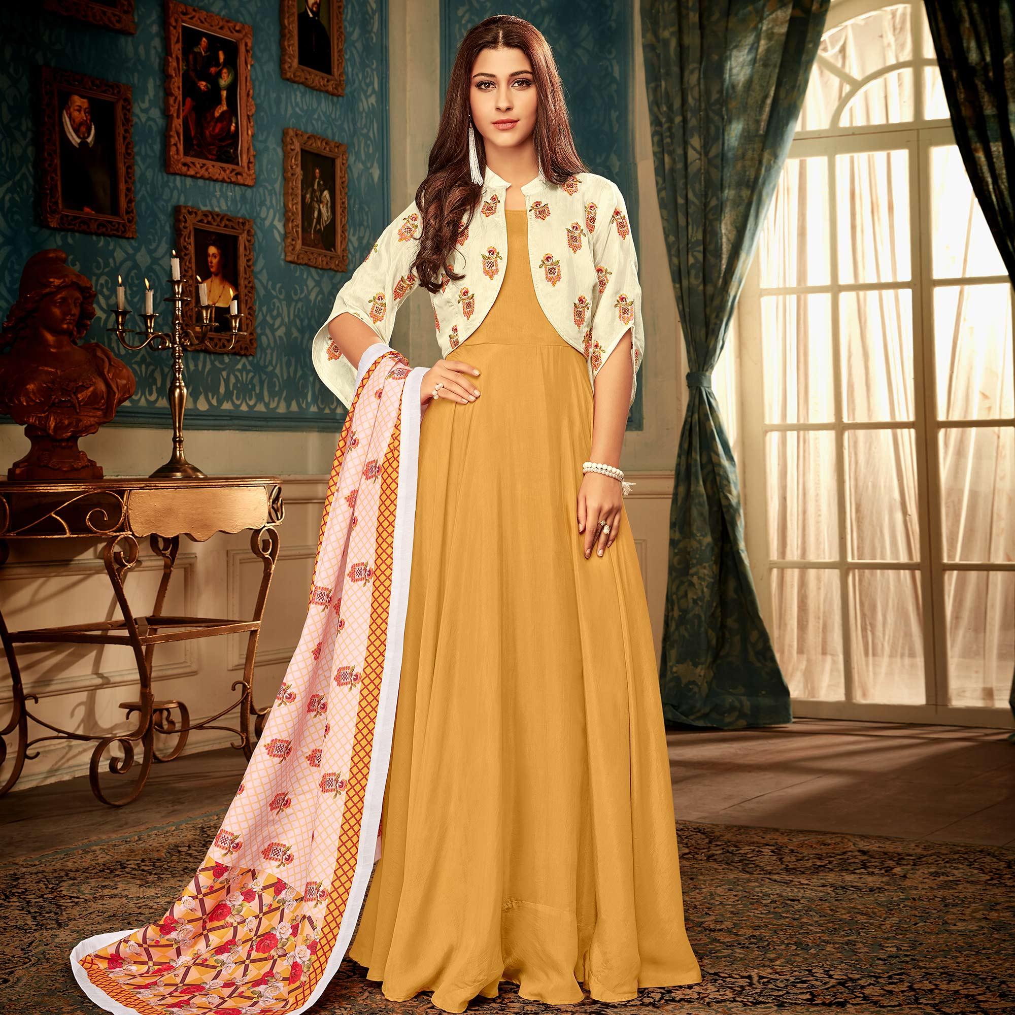 Majesty Mustard Yellow Colored Partywear Embroidered Heavy Muslin Gown - Peachmode