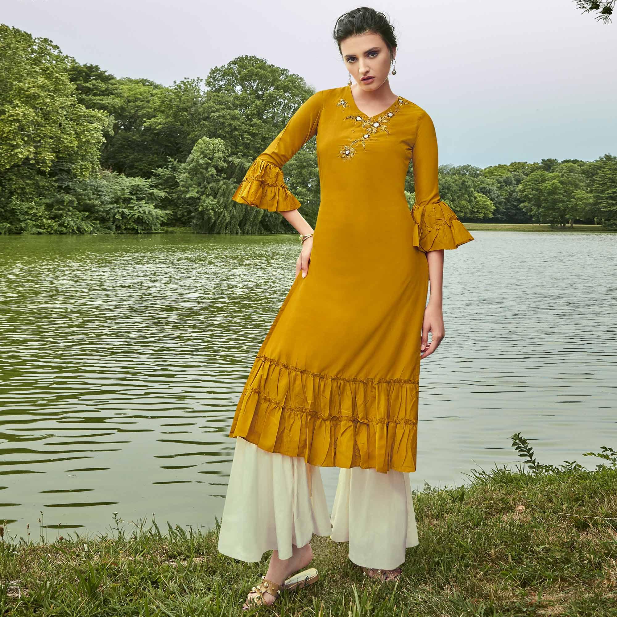 Majesty Mustard Yellow Colored Partywear Hand Embroidered Muslin Silk Kurti-Palazzo Set - Peachmode